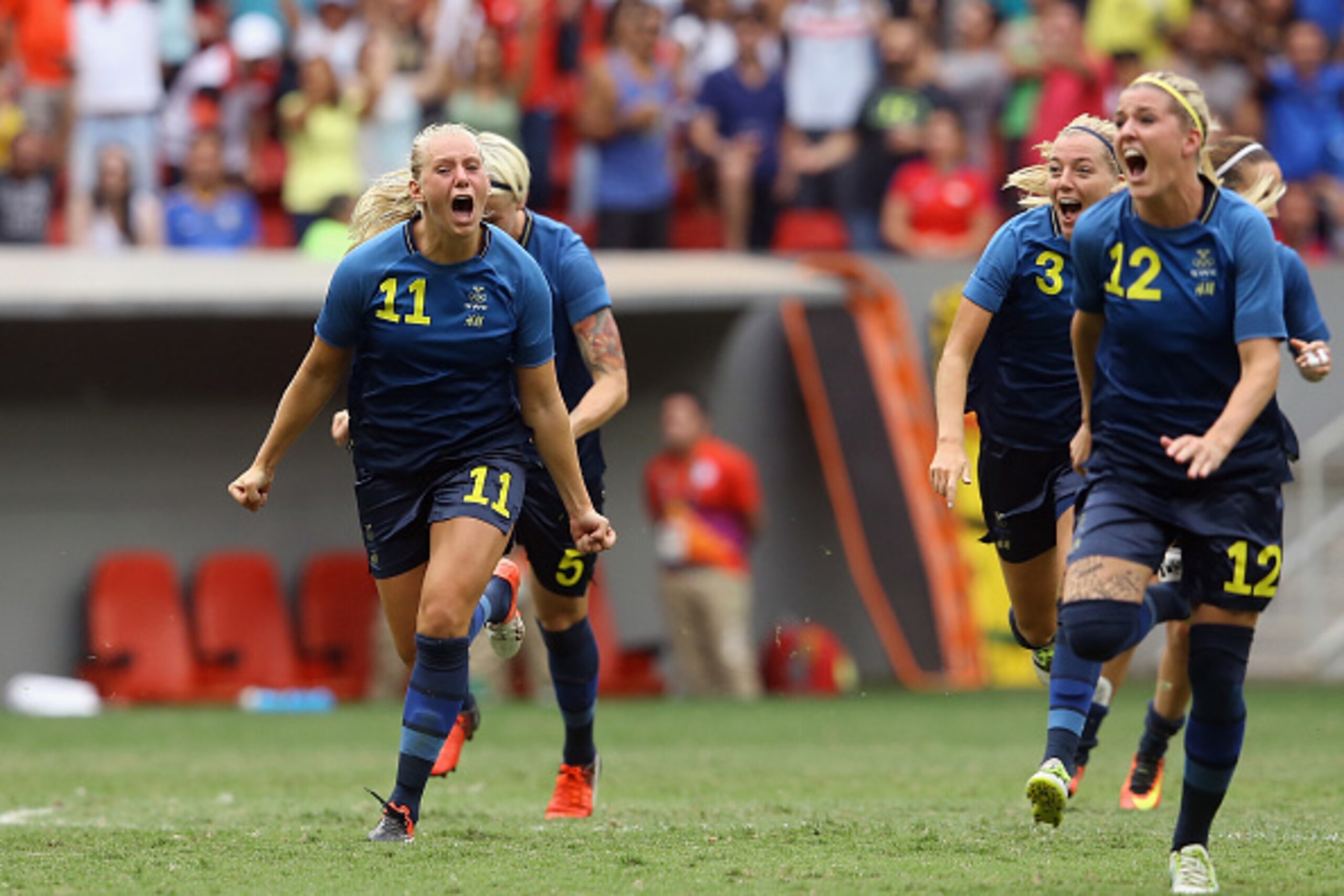 BRASILIA, BRAZIL - AUGUST 12:  Stina Blackstenius #11 and Olivia Schough #12 of Sweden celebrates their 1-1 (4-3 PSO) win over team United States during the Women's Football Quarterfinal match at Mane Garrincha Stadium on Day 7 of the Rio 2016 Olympic Gam
