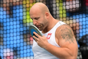 Poland's Piotr Malachowski competes in the Men's Discus Throw Qualifying Round during the athletics event at the Rio 2016 Olympic Games at the Olympic Stadium in Rio de Janeiro on August 12, 2016.   / AFP / FRANCK FIFE        (Photo credit should read FRA