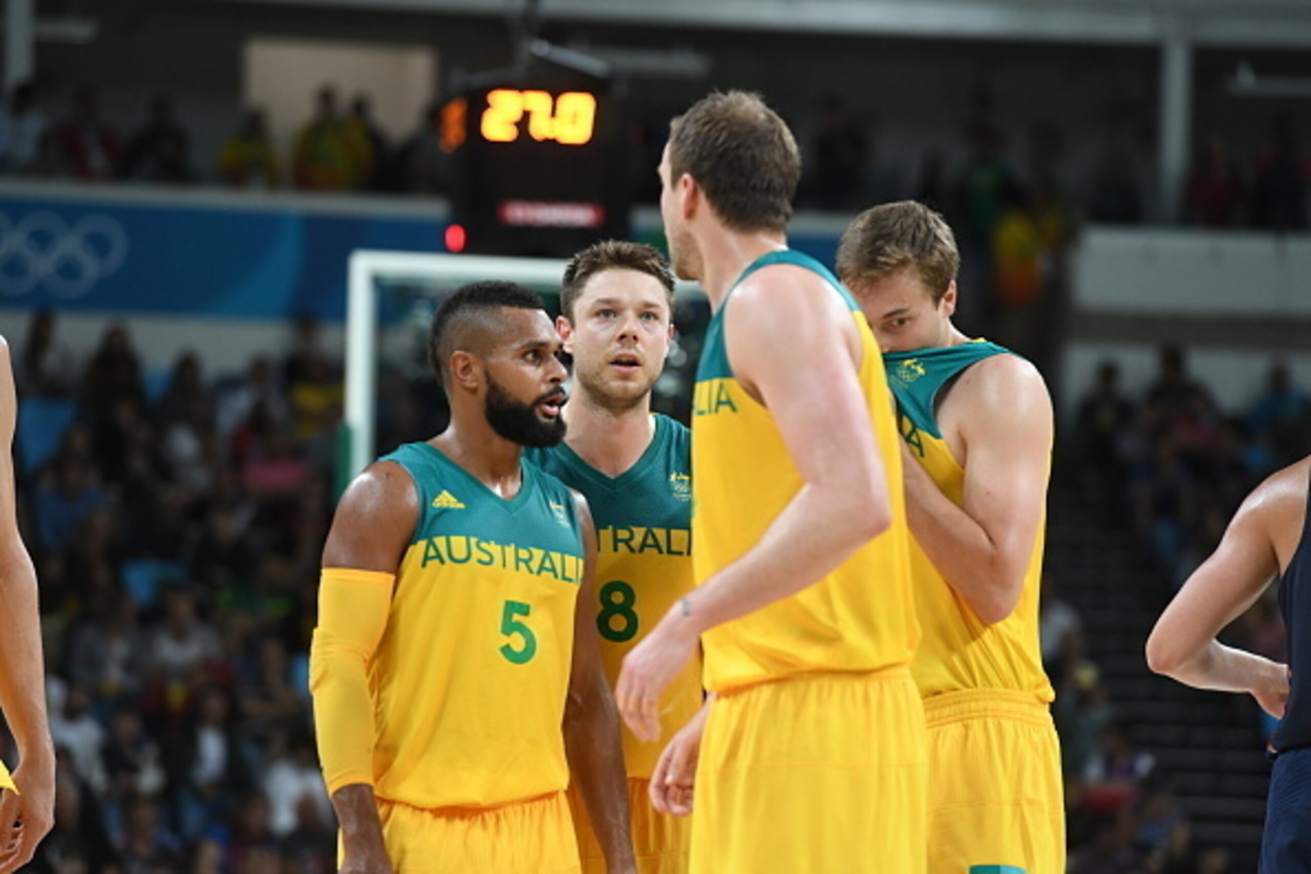 RIO DE JANEIRO, BRAZIL - AUGUST 10:  Patty Mills #5 of Australia and Matthew Dellavedova #8 of Australia huddle during the game against the USA Basketball Men's National Team on Day 5 of the Rio 2016 Olympic Games on August 10, 2016 at Barra Carioca Arena