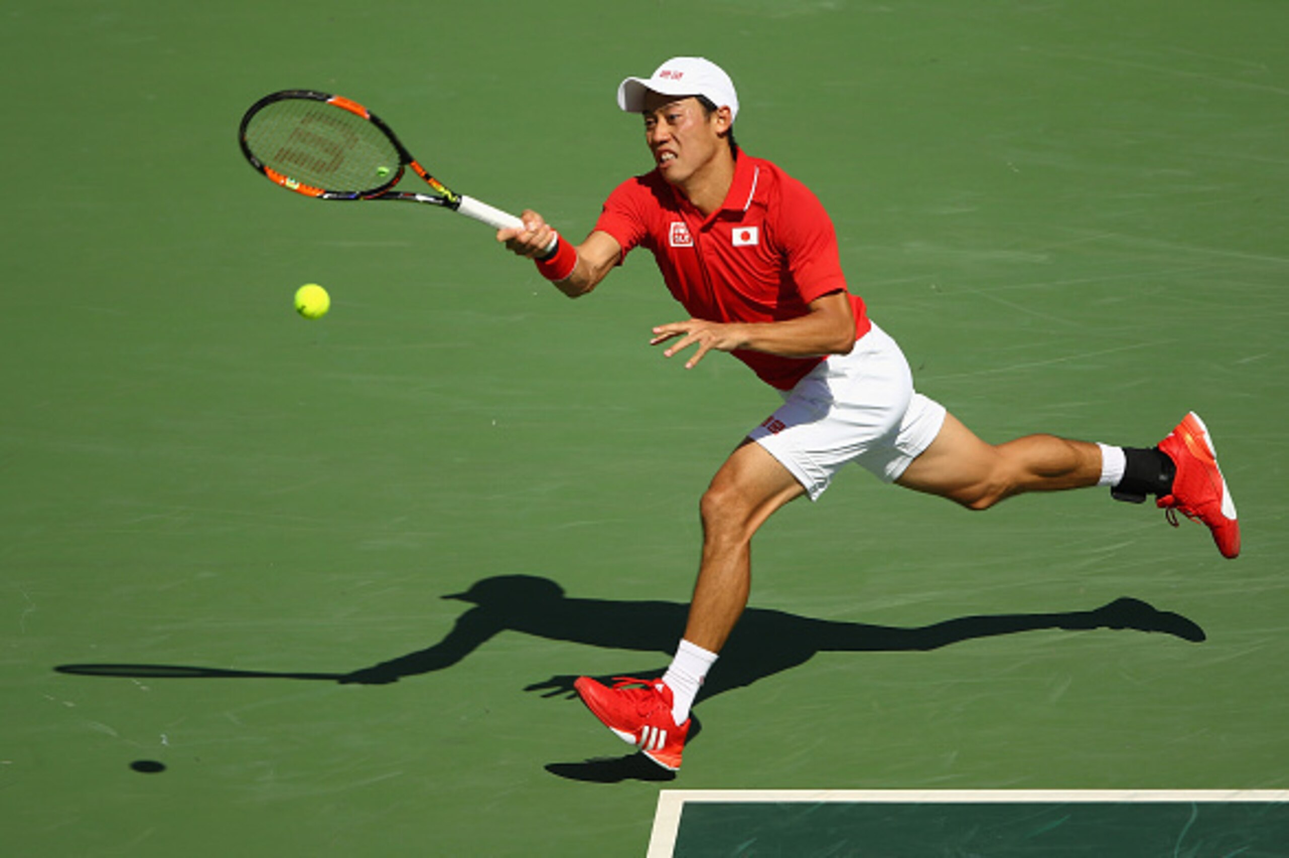 RIO DE JANEIRO, BRAZIL - AUGUST 13:  Kei Nishikori of Japan returns a shot against Andy Murray of Great Britain during the Men's Singles Semifinal Match on Day 8 of the Rio 2016 Olympic Games at the Olympic Tennis Centre on August 13, 2016 in Rio de Janei