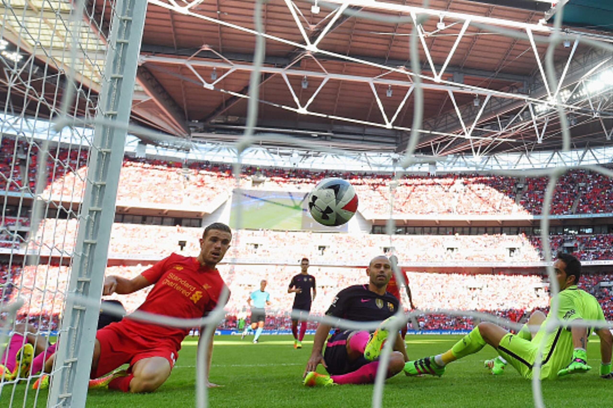 LONDON, ENGLAND - AUGUST 06:  Javier Mascherano of Barcelona scores an own goal for Liverpool's second goal during the International Champions Cup match between Liverpool and Barcelona at Wembley Stadium on August 6, 2016 in London, England.  (Photo by Mi