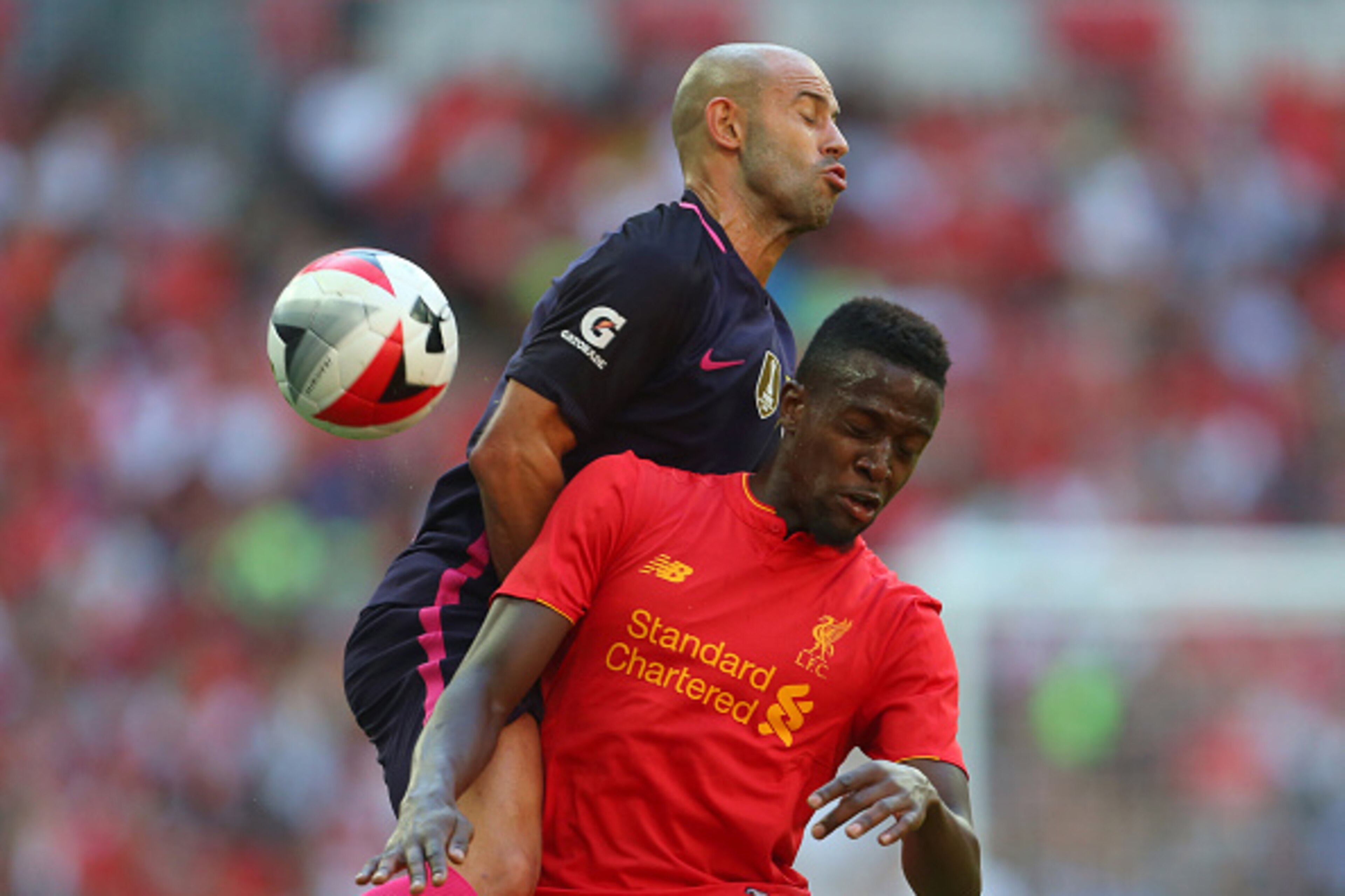 LONDON, ENGLAND - AUGUST 06: Javier Mascherano of FC Barcelona and Divock Origi of Liverpool during the International Champions Cup 2016 match between Liverpool and Barcelona at Wembley Stadium on August 6, 2016 in London, England. (Photo by Catherine Ivi