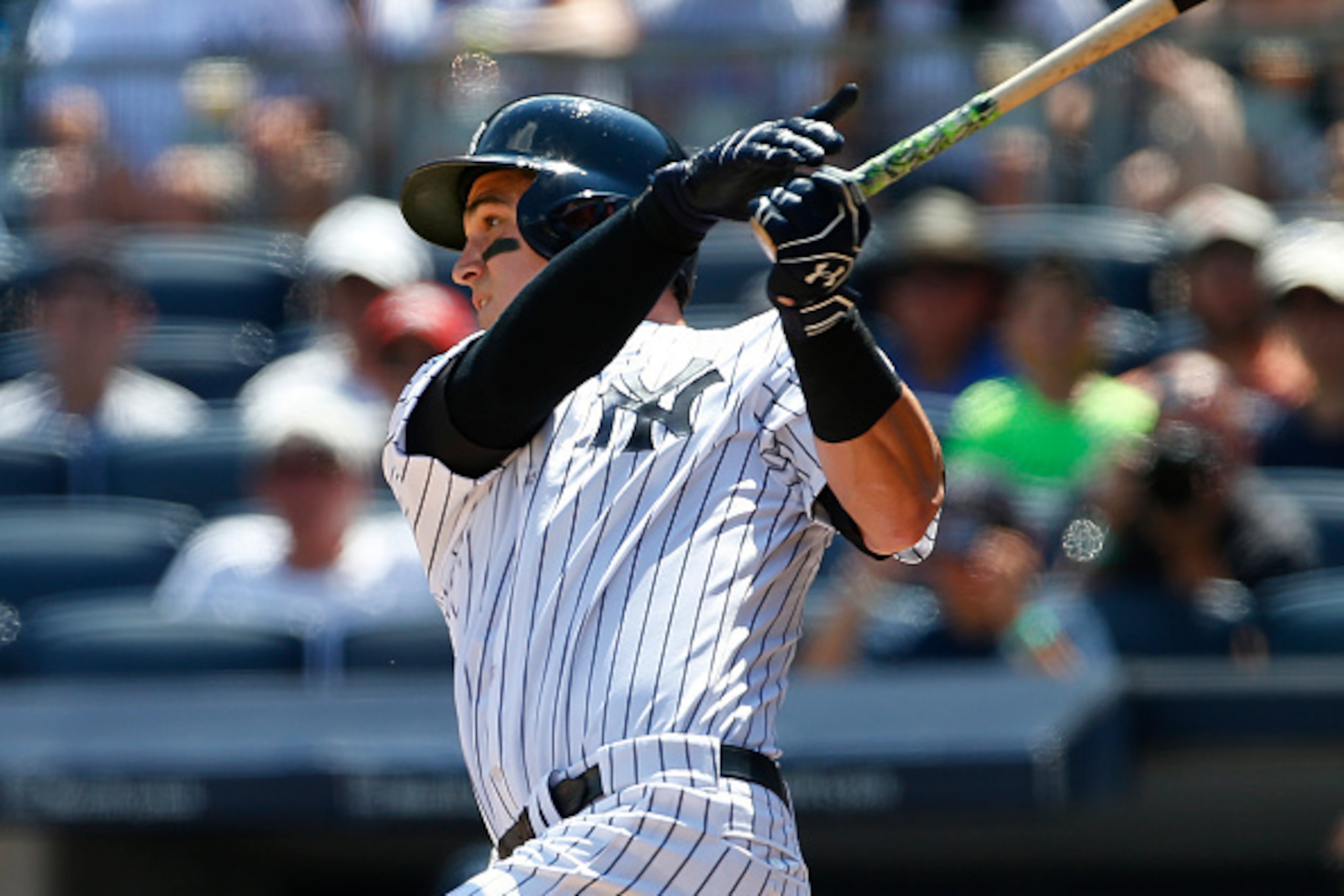 NEW YORK, NY - AUGUST 13: Tyler Austin #26 of the New York Yankees hits a home run in his first MLB at bat during the second inning of a game against the Tampa Bay Rays at Yankee Stadium on August 13, 2016 in the Bronx borough of New York City. (Photo by 