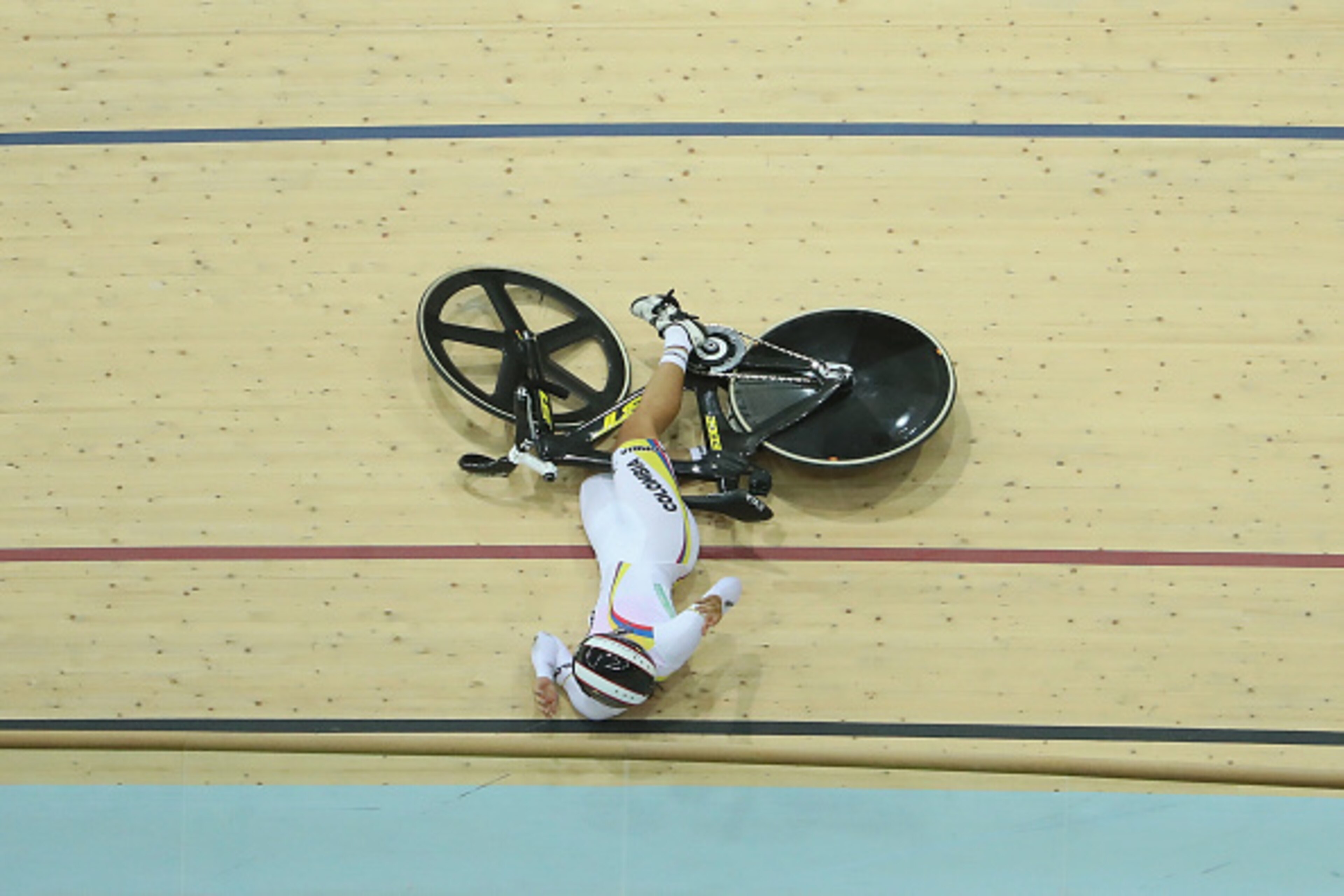 RIO DE JANEIRO, BRAZIL - AUGUST 13:  Martha Bayona Pineda (1st R) of Colombia crashes out in the Women's Keirin Second round heat 1 on Day 8 of the Rio 2016 Olympic Games at the Rio Olympic Velodrome on August 13, 2016 in Rio de Janeiro, Brazil.  (Photo b