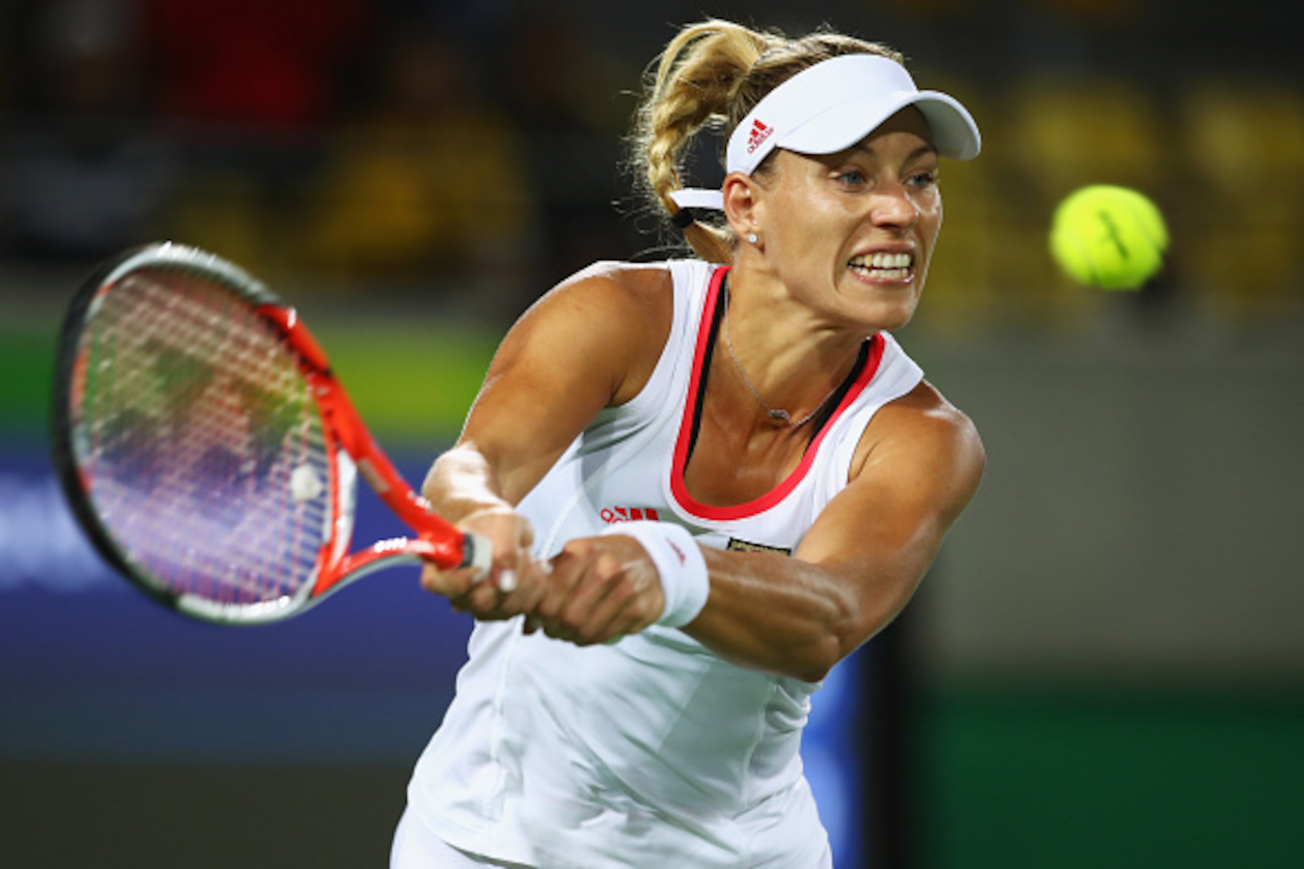 RIO DE JANEIRO, BRAZIL - AUGUST 12:  Angelique Kerber of Germany returns a shot during the women's singles semifinal match against Madison Keys of the United States on Day 7 of the Rio 2016 Olympic Games at the Olympic Tennis Centre on August 12, 2016 in 