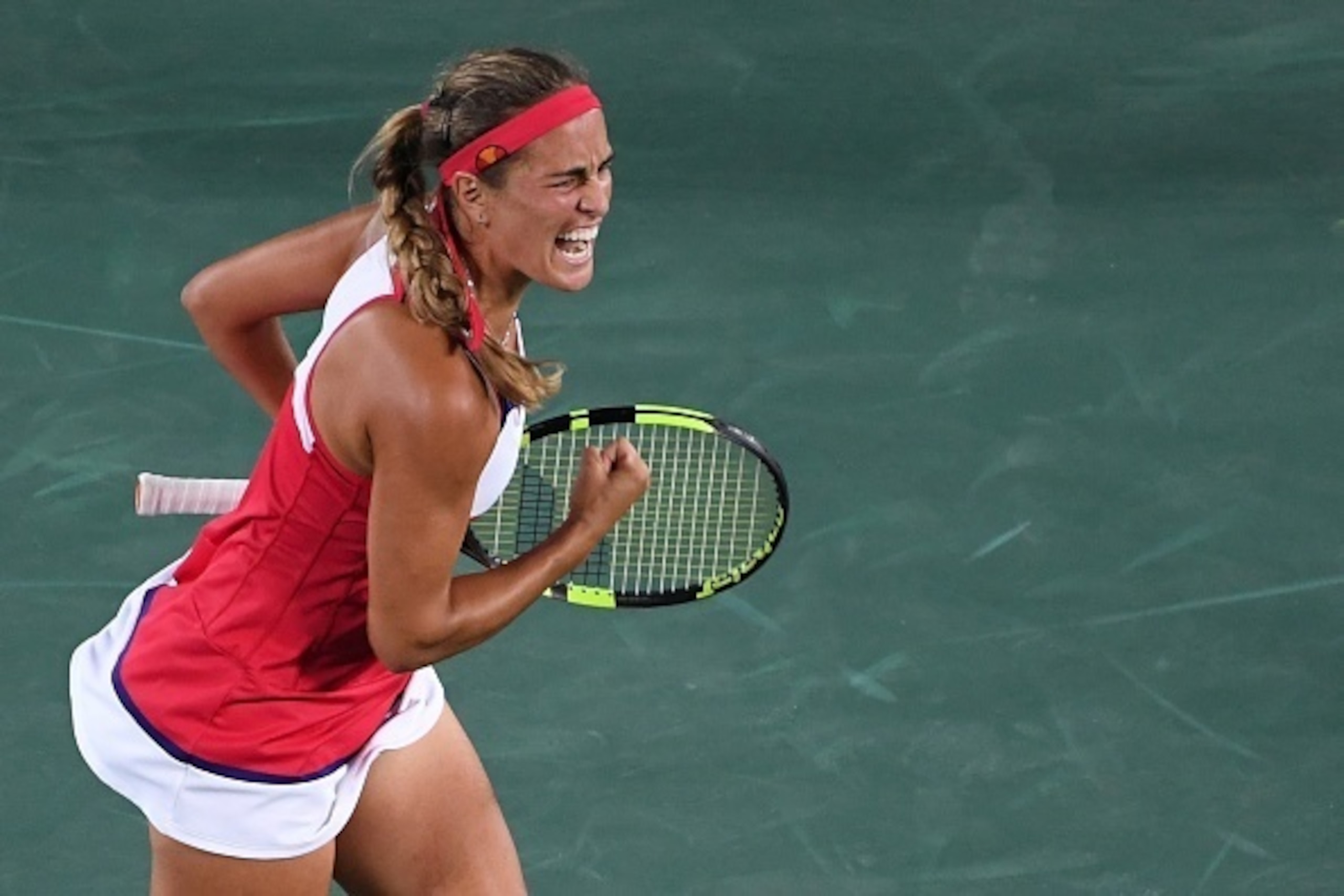 Puerto Rico's Monica Puig reacts after winning a point against Germany's Angelique Kerber during their women's singles final tennis match at the Olympic Tennis Centre of the Rio 2016 Olympic Games in Rio de Janeiro on August 13, 2016. / AFP / Luis Acosta 