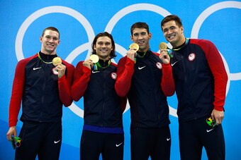 RIO DE JANEIRO, BRAZIL - AUGUST 13:  Gold medalists Ryan Murphy, Cody Miller, Michael Phelps and Nathan Adrian of the United States pose on the podium during the medal ceremony for the Men's 4 x 100m Medley Relay Final on Day 8 of the Rio 2016 Olympic Gam