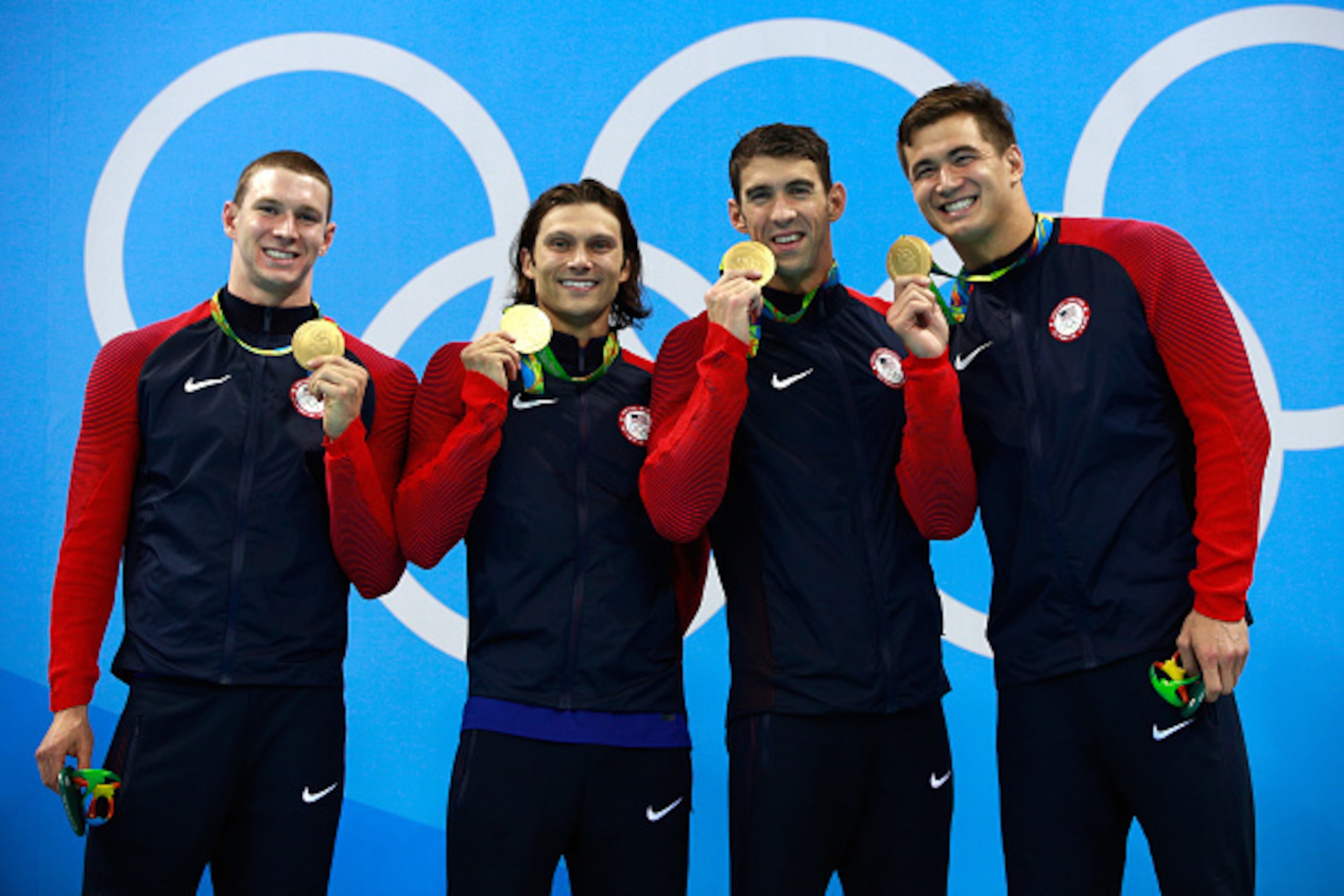 RIO DE JANEIRO, BRAZIL - AUGUST 13:  Gold medalists Ryan Murphy, Cody Miller, Michael Phelps and Nathan Adrian of the United States pose on the podium during the medal ceremony for the Men's 4 x 100m Medley Relay Final on Day 8 of the Rio 2016 Olympic Gam