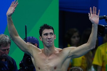 RIO DE JANEIRO, BRAZIL - AUGUST 13:  Michael Phelps of the United States thanks the crowd after winning gold in the Men's 4 x 100m Medley Relay Final on Day 8 of the Rio 2016 Olympic Games at the Olympic Aquatics Stadium on August 13, 2016 in Rio de Janei