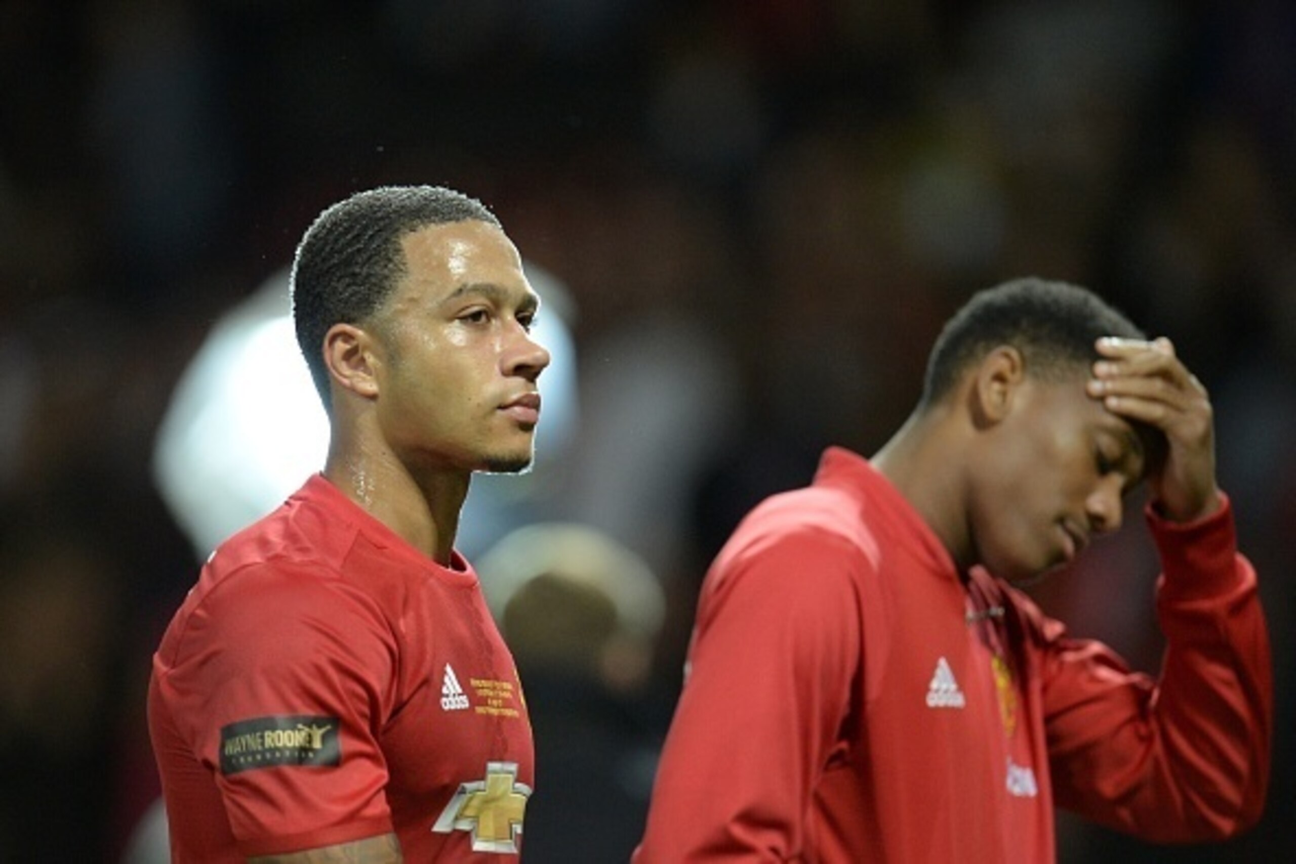 Manchester United's Dutch midfielder Memphis Depay (L) and Manchester United's French striker Anthony Martial (R) leave the pitch at the end of the friendly Wayne Rooney testimonial football match between Manchester United and Everton at Old Trafford in M Manchester United's Dutch midfielder Memphis Depay (L) and Manchester United's French striker Anthony Martial (R) leave the pitch at the end of the friendly Wayne Rooney testimonial football match between Manchester United and Everton at Old Trafford in M