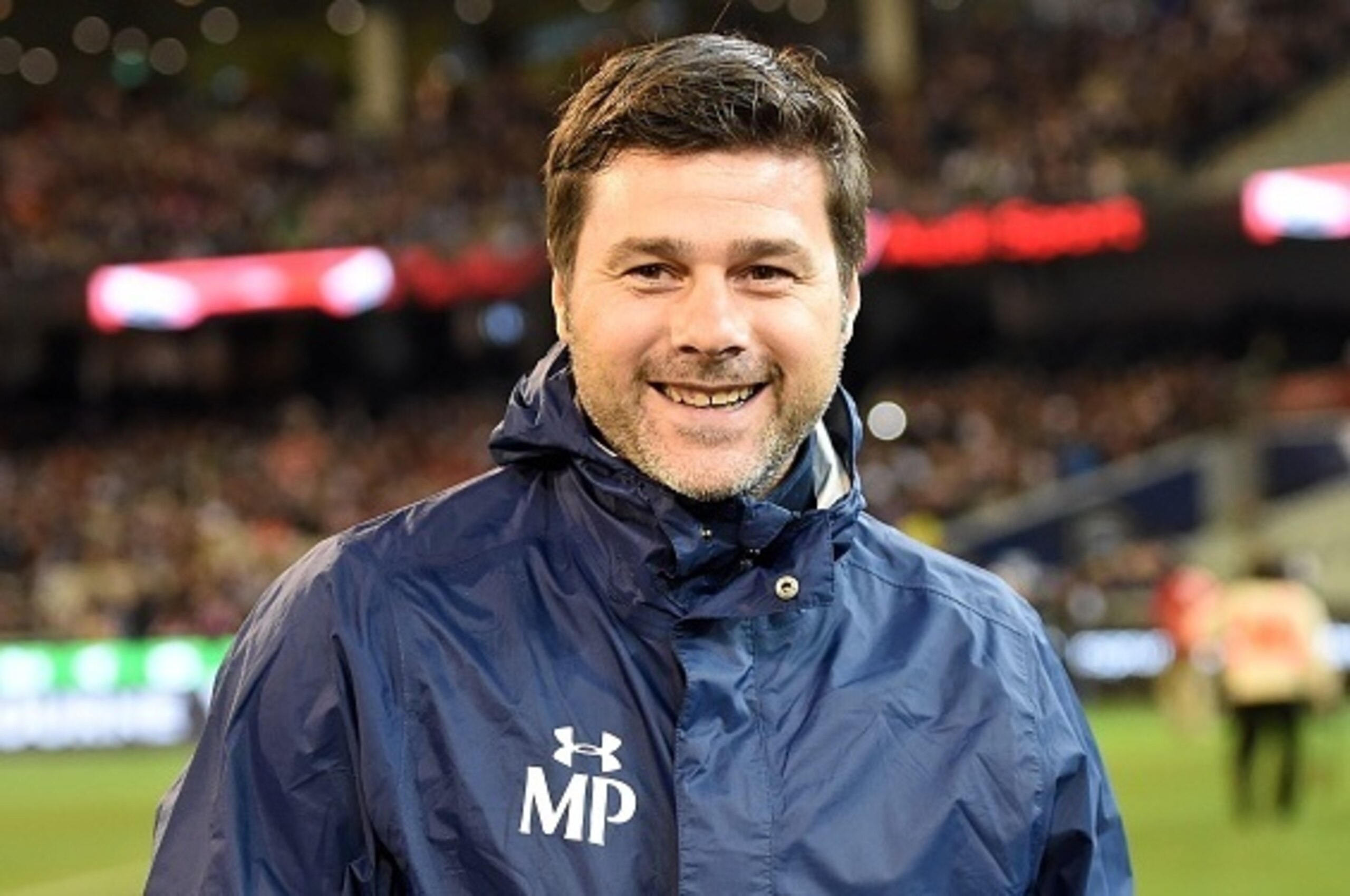 Tottenham Hotspur team manager Mauricio Pochettino smiles as he walks onto the pitch prior to the International Champions Cup football match between English Premier League team Tottenham Hotspur and Spanish club Atletico Madrid in Melbourne on July 29, 20