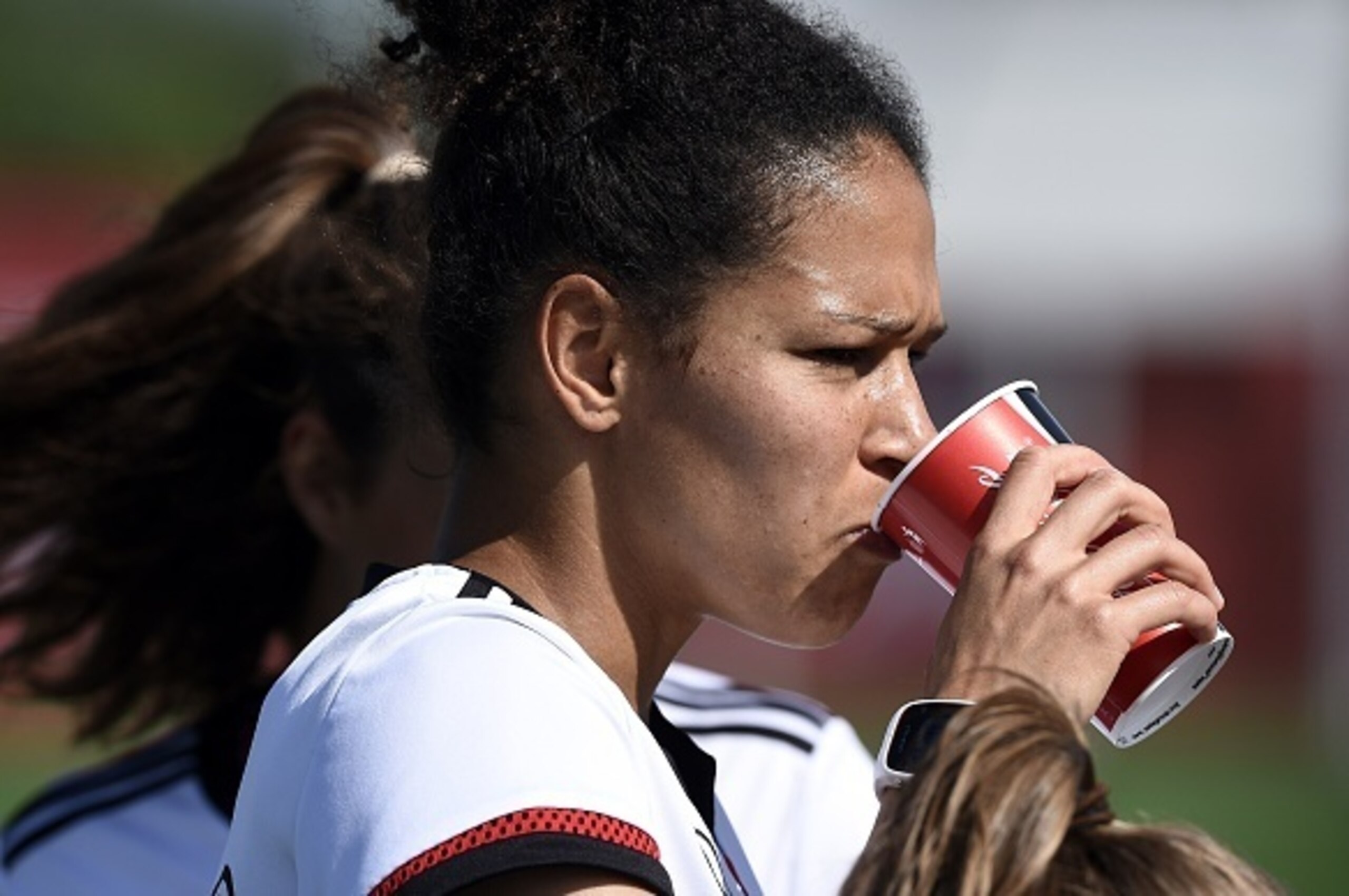 Germany's forward Celia Sasic hydrates during a training session in Laval, near Montreal on June 23, 2015 during the FIFA Women's World Cup.  AFP PHOTO / FRANCK FIFE        (Photo credit should read FRANCK FIFE/AFP/Getty Images)