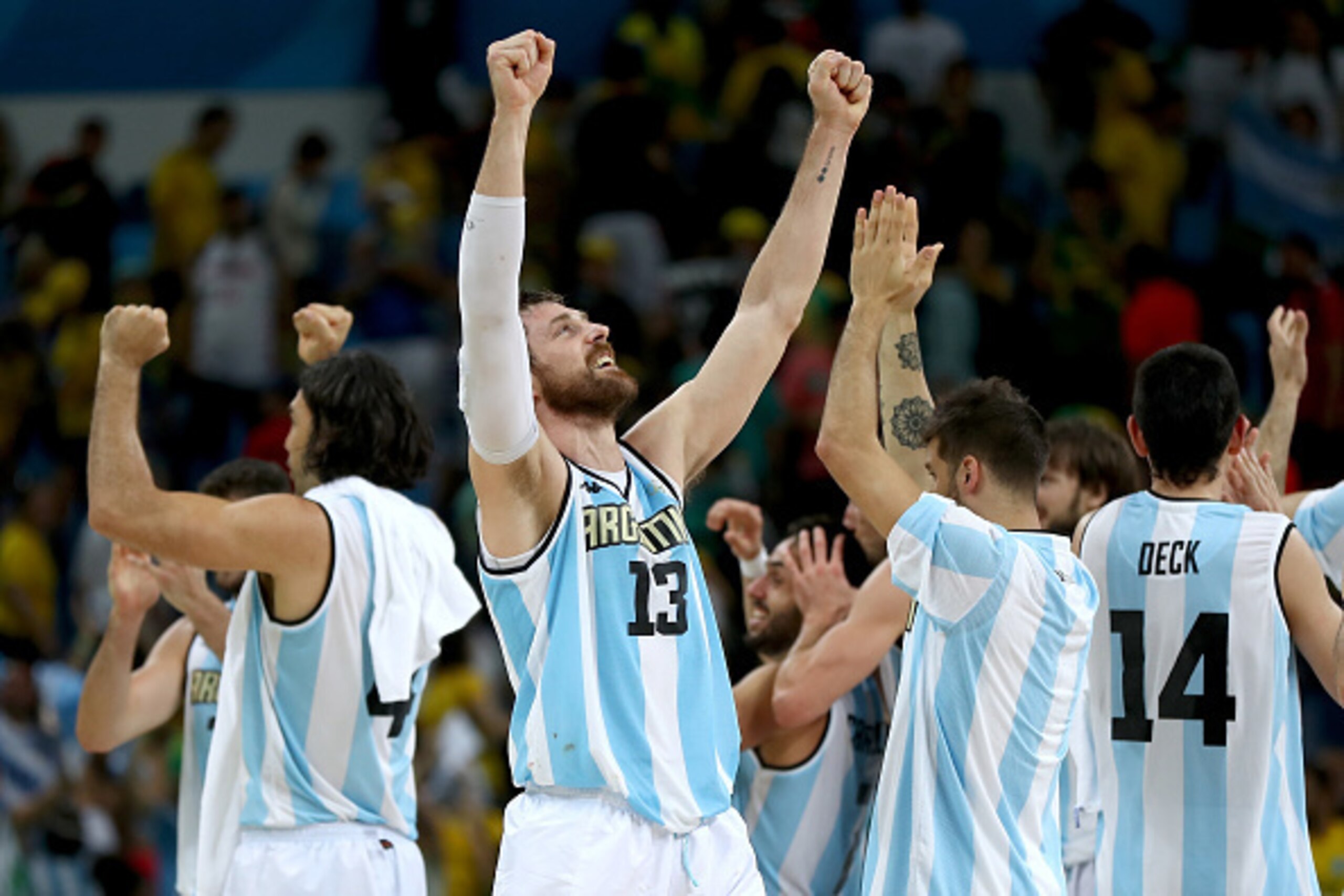 RIO DE JANEIRO, BRAZIL - AUGUST 13:  Andres Nocioni #13 of Argentina and the rest of this teammates celebrate the 111-107 double overtime win over Brazil during the Men's Preliminary Round Group B match on day 8 of the Rio 2016 Olympic Games at Carioca Ar