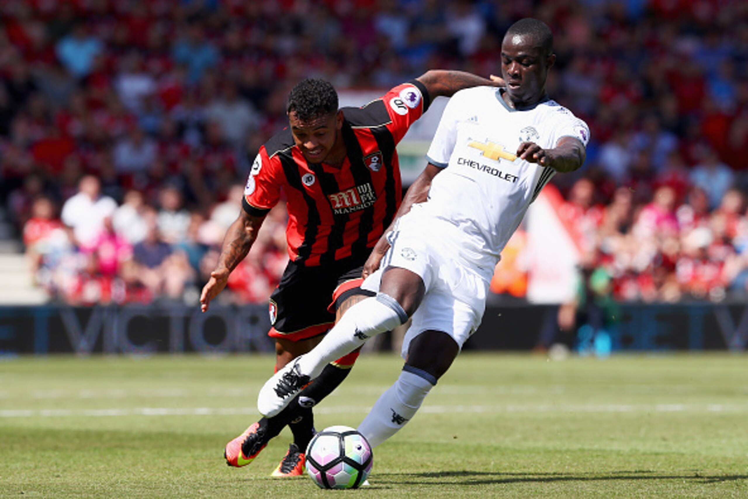 BOURNEMOUTH, ENGLAND - AUGUST 14: Eric Bailly of Manchester United is challenged by Joshua King of AFC Bournemouth during the Premier League match between AFC Bournemouth and Manchester United at Vitality Stadium on August 14, 2016 in Bournemouth, England