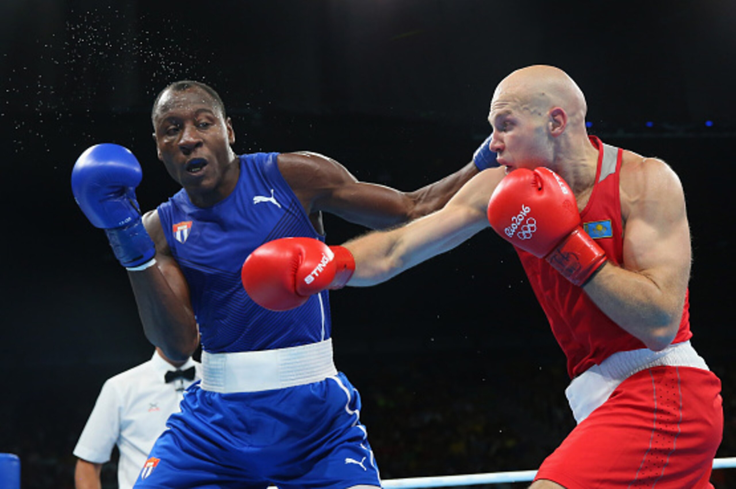 RIO DE JANEIRO, BRAZIL - AUGUST 13: Erislandy Savon of Cuba and Vassiliy Levit of Kazakhstan trade punches in the Men's Super Heavyweight (+91g) preliminaries on Day 8 of the 2016 Rio Olympics at Riocentro - Pavilion 6 on August 13, 2016 in Rio de Janeir RIO DE JANEIRO, BRAZIL - AUGUST 13: Erislandy Savon of Cuba and Vassiliy Levit of Kazakhstan trade punches in the Men's Super Heavyweight (+91g) preliminaries on Day 8 of the 2016 Rio Olympics at Riocentro - Pavilion 6 on August 13, 2016 in Rio de Janeir