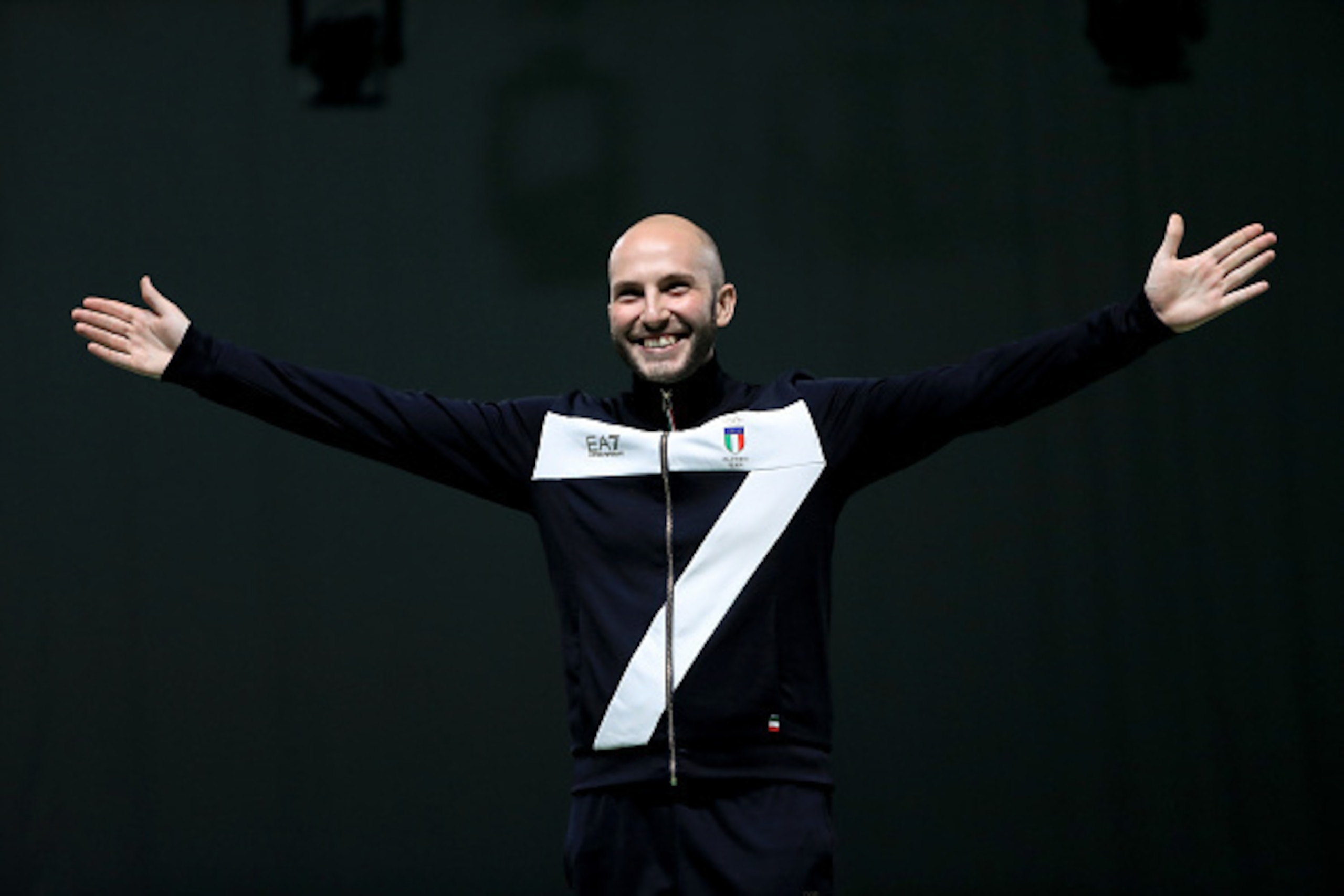 RIO DE JANEIRO, BRAZIL - AUGUST 08:  Niccolo Campriani of Italy smiles on the podium prior to receiving his gold medal for winning the 10m Air Rifle event on Day 3 of the Rio 2016 Olympic Games at the Olympic Shooting Centre on August 8, 2016 in Rio de Ja