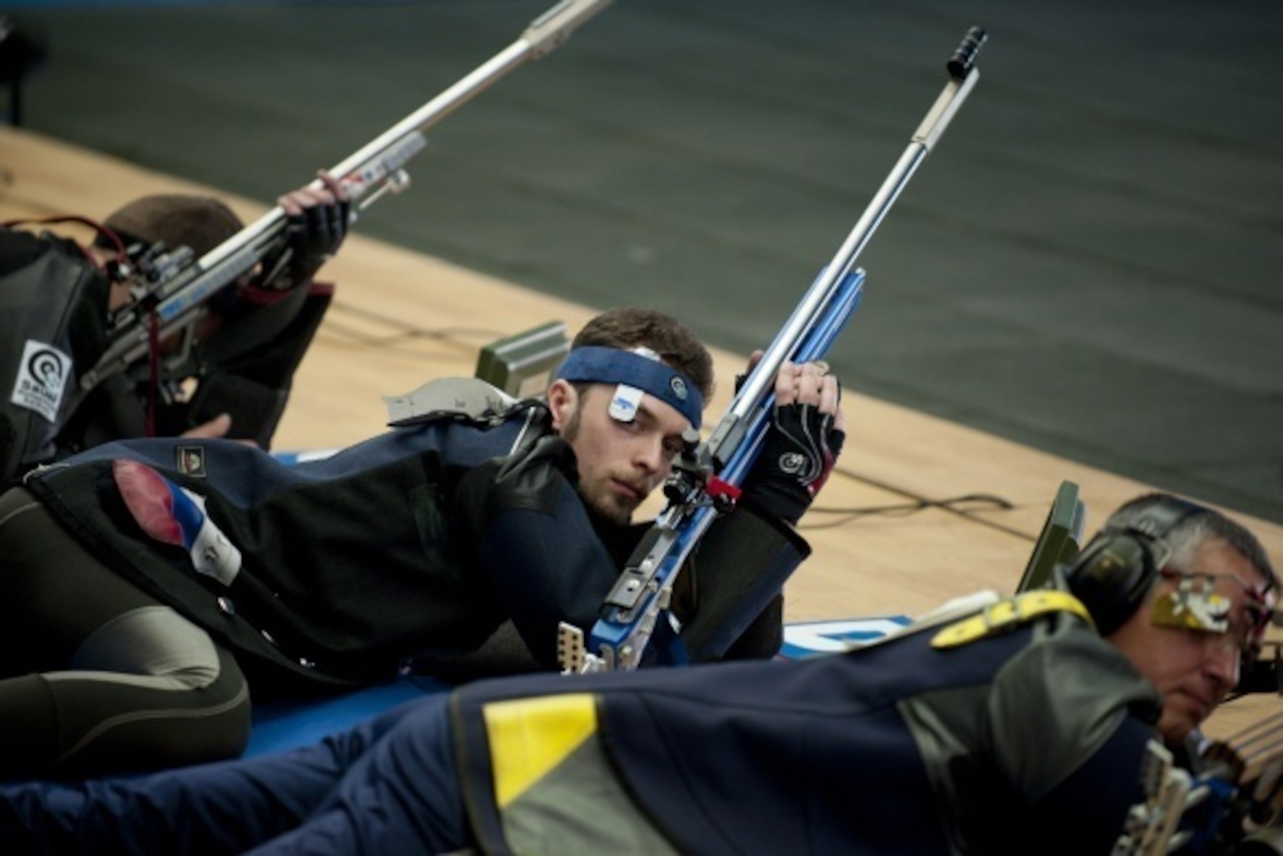 Russian shooter Sergey Kamenskiy (C) competes in the 50m Rifle Prone Men final during the 51st ISSF World Championship in Las Gabias, near Granada on September 11, 2014.   AFP PHOTO/ JORGE GUERRERO        (Photo credit should read Jorge Guerrero/AFP/Getty