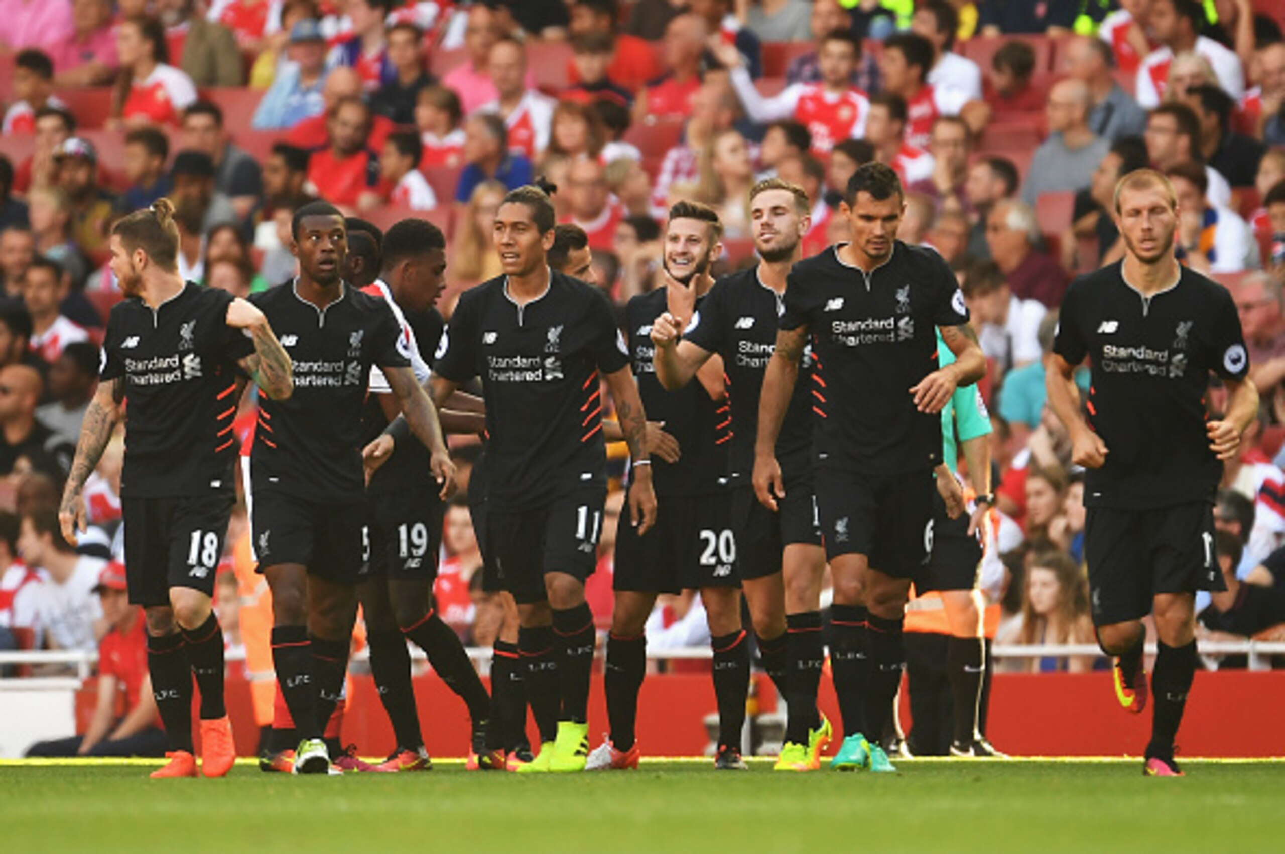 LONDON, ENGLAND - AUGUST 14:  Adam Lallana of Liverpool celebrates scoring his team's second goal during the Premier League match between Arsenal and Liverpool at Emirates Stadium on August 14, 2016 in London, England.  (Photo by Mike Hewitt/Getty Images)