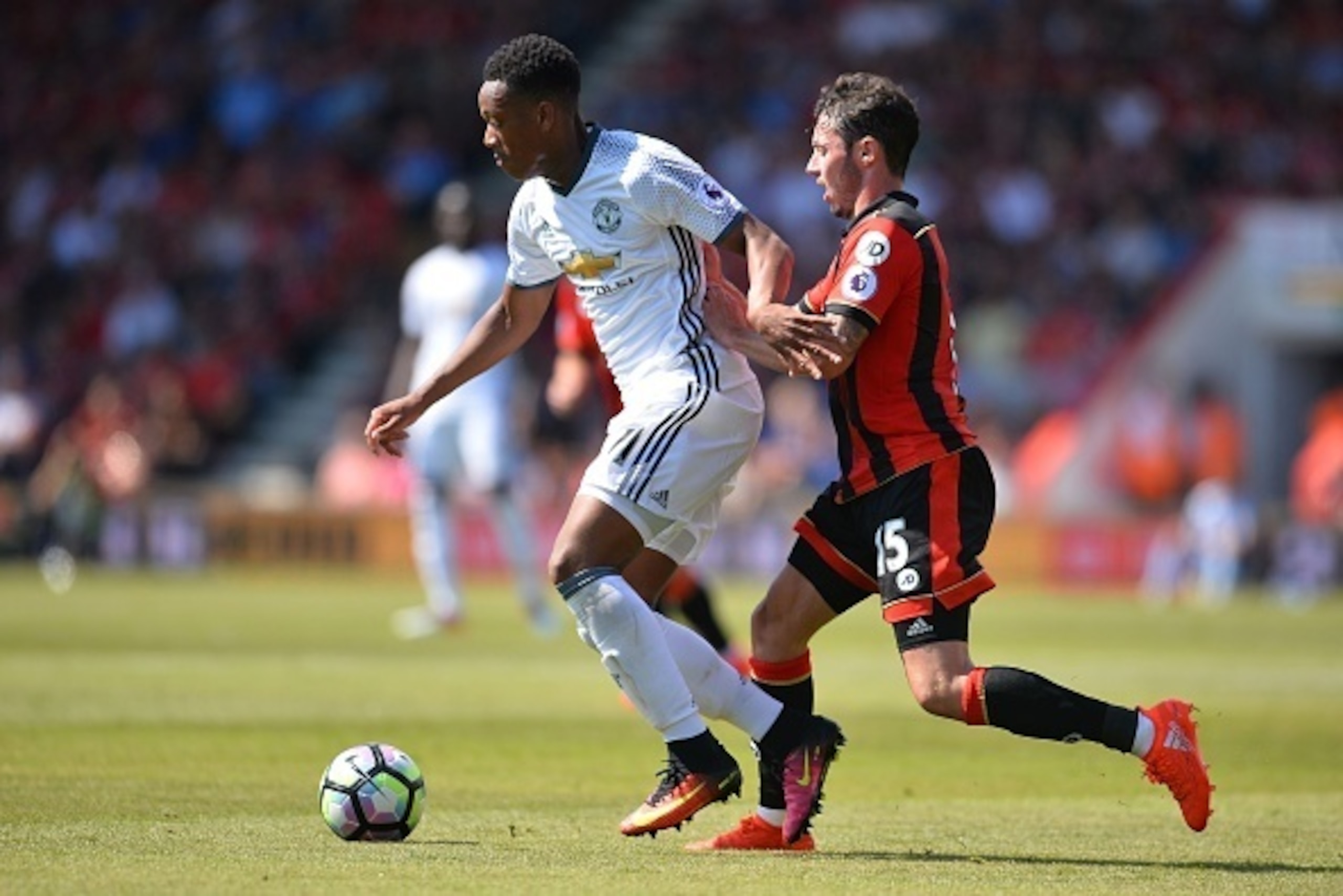 Manchester United's French striker Anthony Martial (L) holds off Bournemouth's English defender Adam Smith (R) during the English Premier League football match between Bournemouth and Manchester United at the Vitality Stadium in Bournemouth, southern Engl