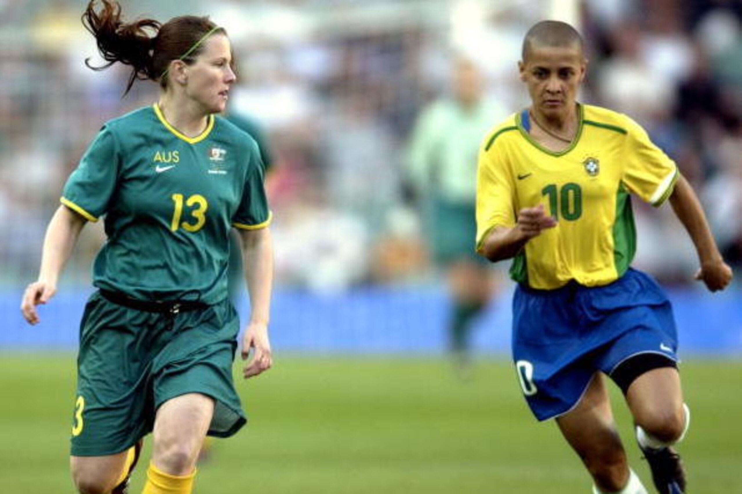 19 Sep 2000:  Alicia Ferguson #13 of Australia looks to pass as she is chased down by Sissi #10 of Brazil during the Women's Group E Football Elimination match on Day Four of the Sydney 2000 Olympic Games between Australia and Brazil at the Sydney Footbal