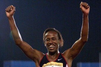 UNIONDALE, UNITED STATES:  Jackie Joyner-Kersee celebrates her victory in the heptathlon 22 July at the 1998 Goodwill Games in Uniondale, NY. Joyner-Kersee, who has said this will be her last heptathlon, won the gold medal with 6502 points.        (ELECTR