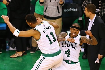 BOSTON, MA - APRIL 24:  Isaiah Thomas #4 of the Boston Celtics celebrates with Evan Turner #11 after hitting a three pointer during overtime of Game Four of the Eastern Conference Quarterfinals against the Atlanta Hawks during the 2016 NBA Playoffs at TD 