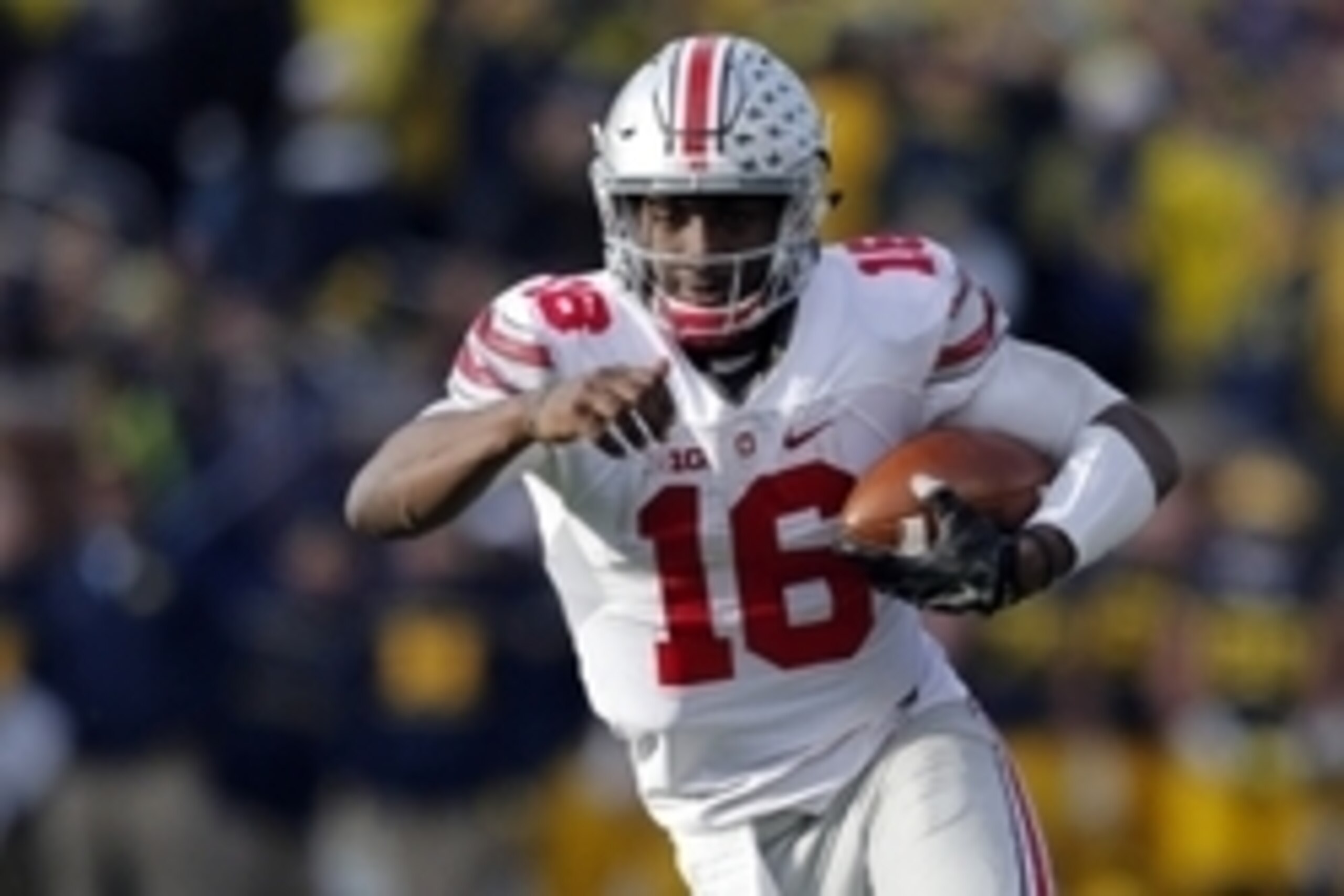 Nov 28, 2015; Ann Arbor, MI, USA; Ohio State Buckeyes quarterback J.T. Barrett (16) rushes in the second half against the Ohio State Buckeyes at Michigan Stadium. Ohio State won 42-13. Mandatory Credit: Rick Osentoski-USA TODAY Sports