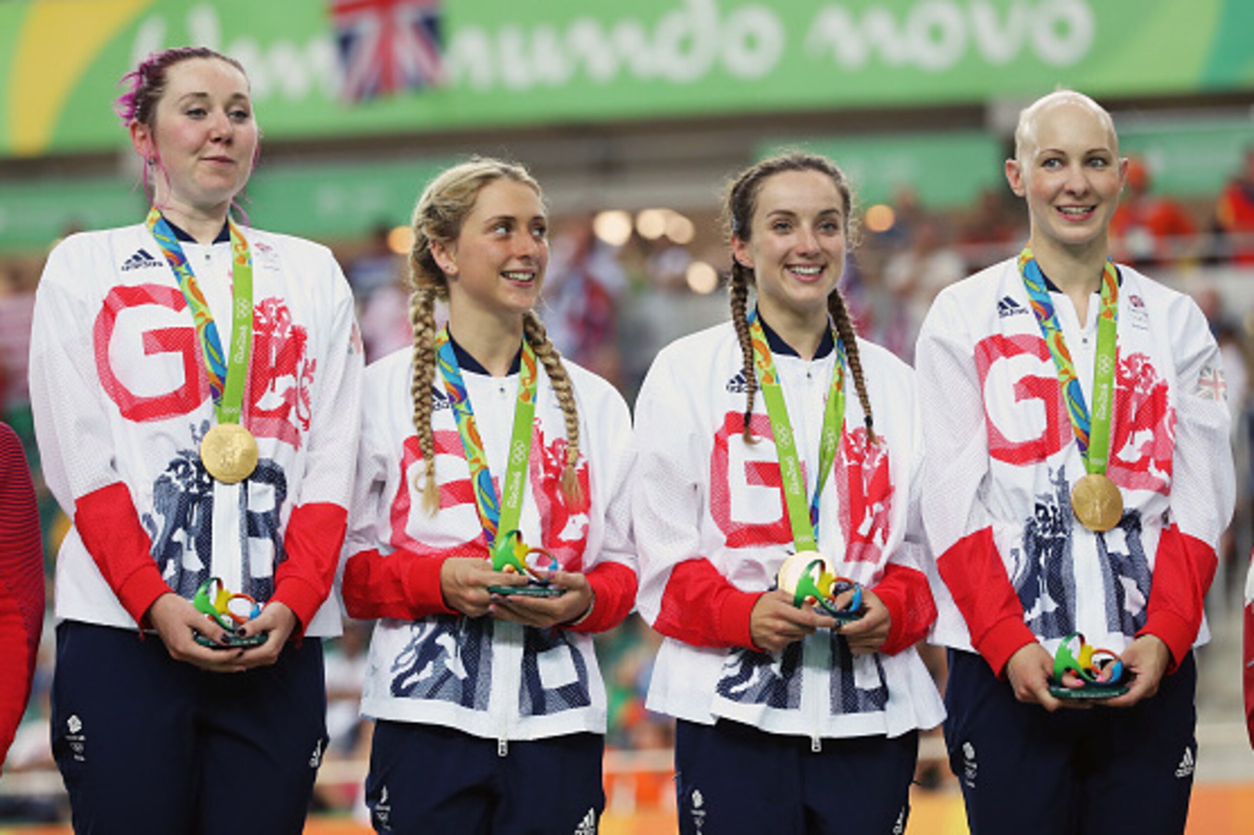RIO DE JANEIRO, BRAZIL - AUGUST 13:  Laura Trott, Joanna Rowsell-Shand, Katie Archibald, Elinor Barker of Great Britain celebrate on the podium at the medal ceremony for the Women's Team Pursuit on Day 8 of the Rio 2016 Olympic Games at the Rio Olympic Ve