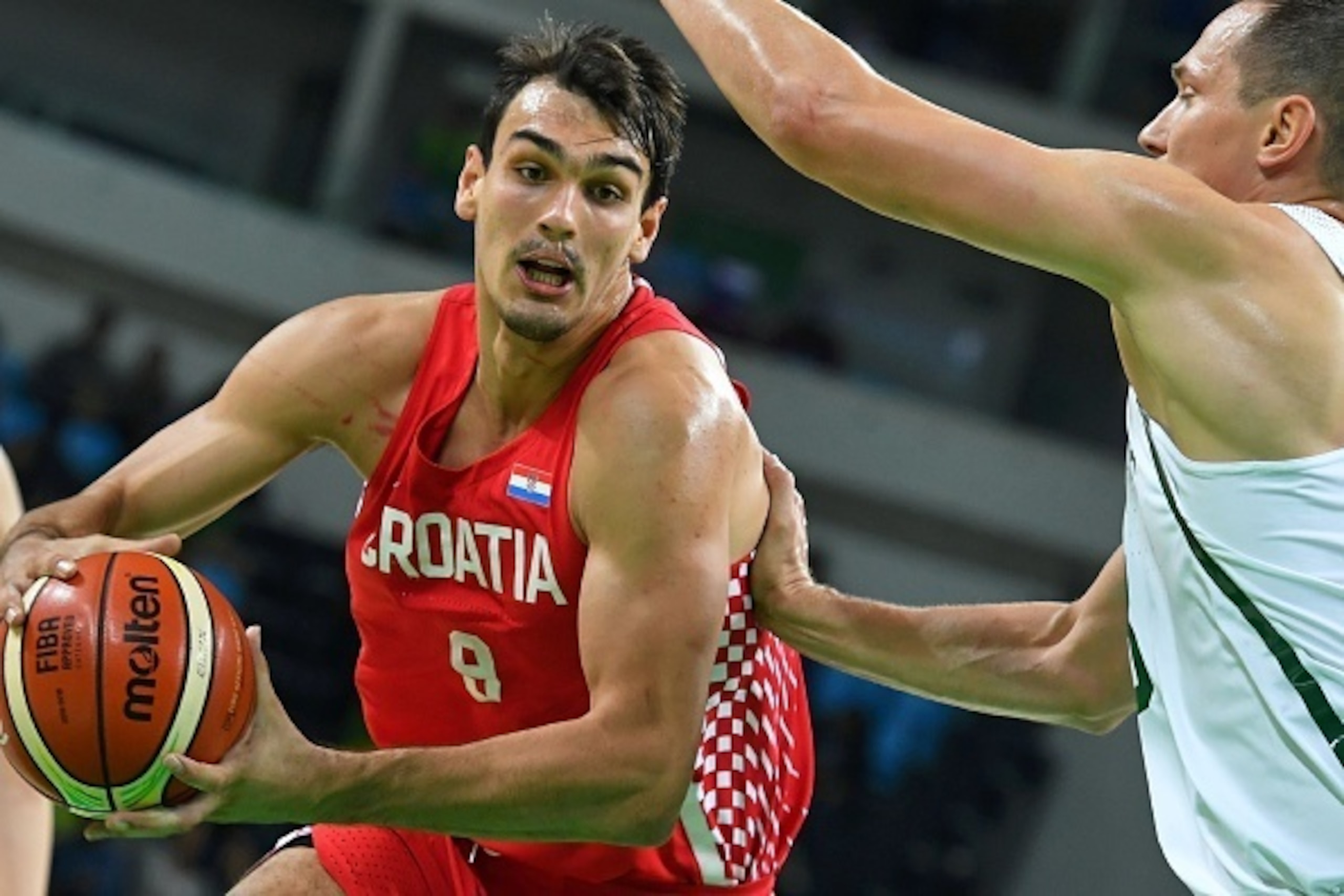 Lithuania's power forward Paulius Jankunas (R) defends against Croatia's forward Dario Saric during a Men's round Group B basketball match between Lithuania and Croatia at the Carioca Arena 1 in Rio de Janeiro on August 15, 2016 during the Rio 2016 Olympi