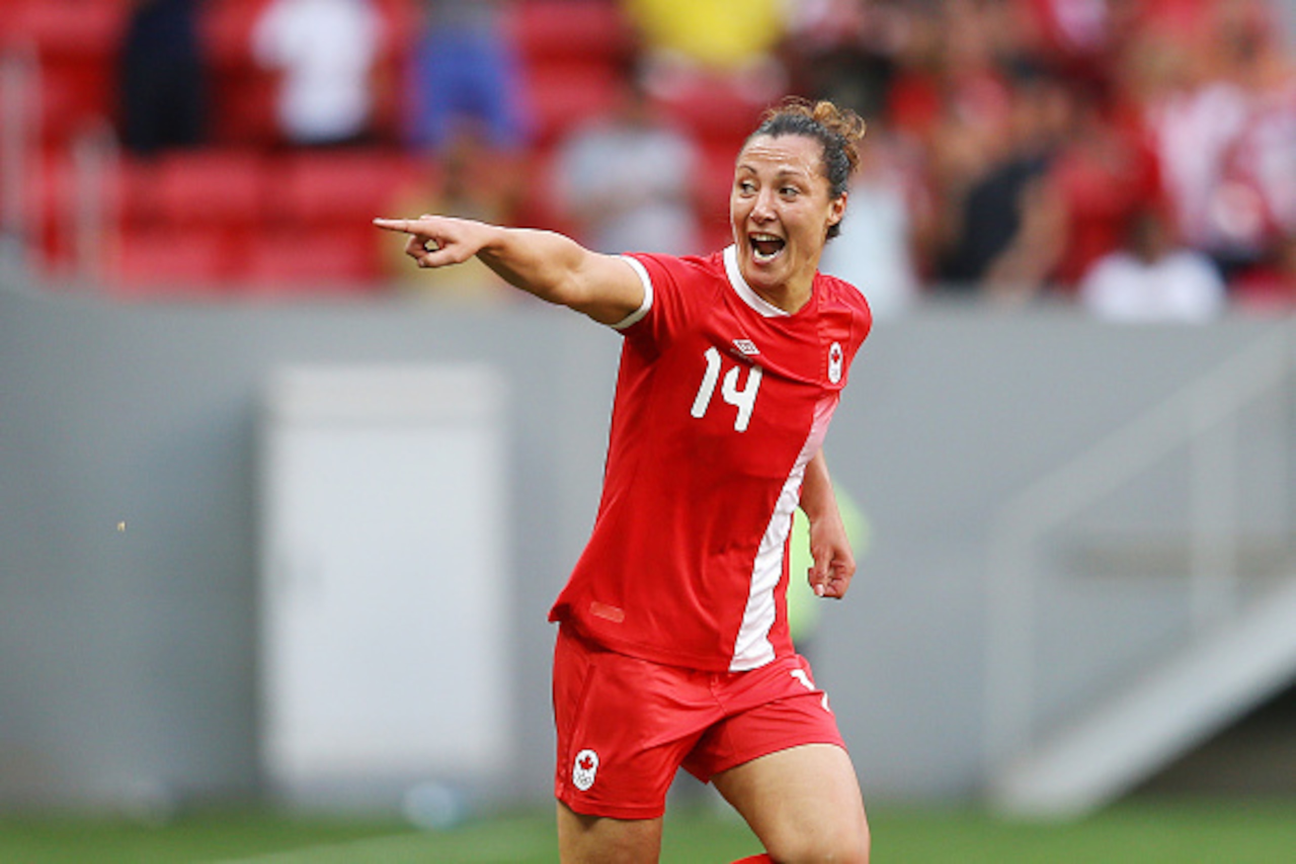 BRASILIA, BRAZIL - AUGUST 09: Melissa Tancredi of Canada celebrates scoring her team's first goal during the Women's First Round Group F match between Germany and Canada on Day 4 of the Rio 2016 Olympic Games at Mane Garrincha Stadium on August 9, 2016 in