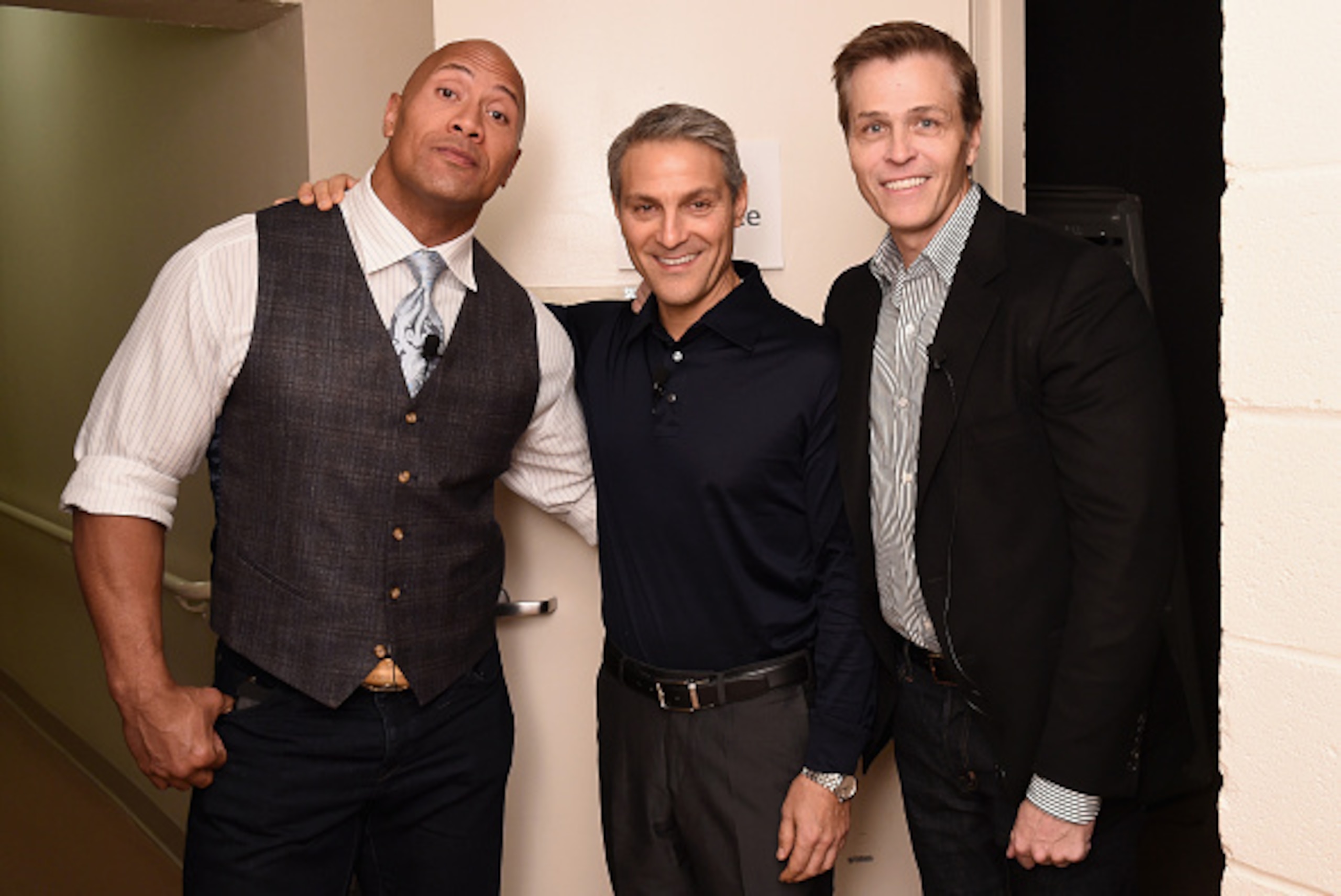 NEW YORK, NY - NOVEMBER 09:  (L-R) Dwayne 'The Rock' Johnson, Ari Emanuel and Patrick Whitesell appear backstage during 'The Next Intersection For Hollywood with William Morris Endeavor's Ari Emanuel, Patrick Whitesell and Dwayne 'The Rock' Johnson' at th