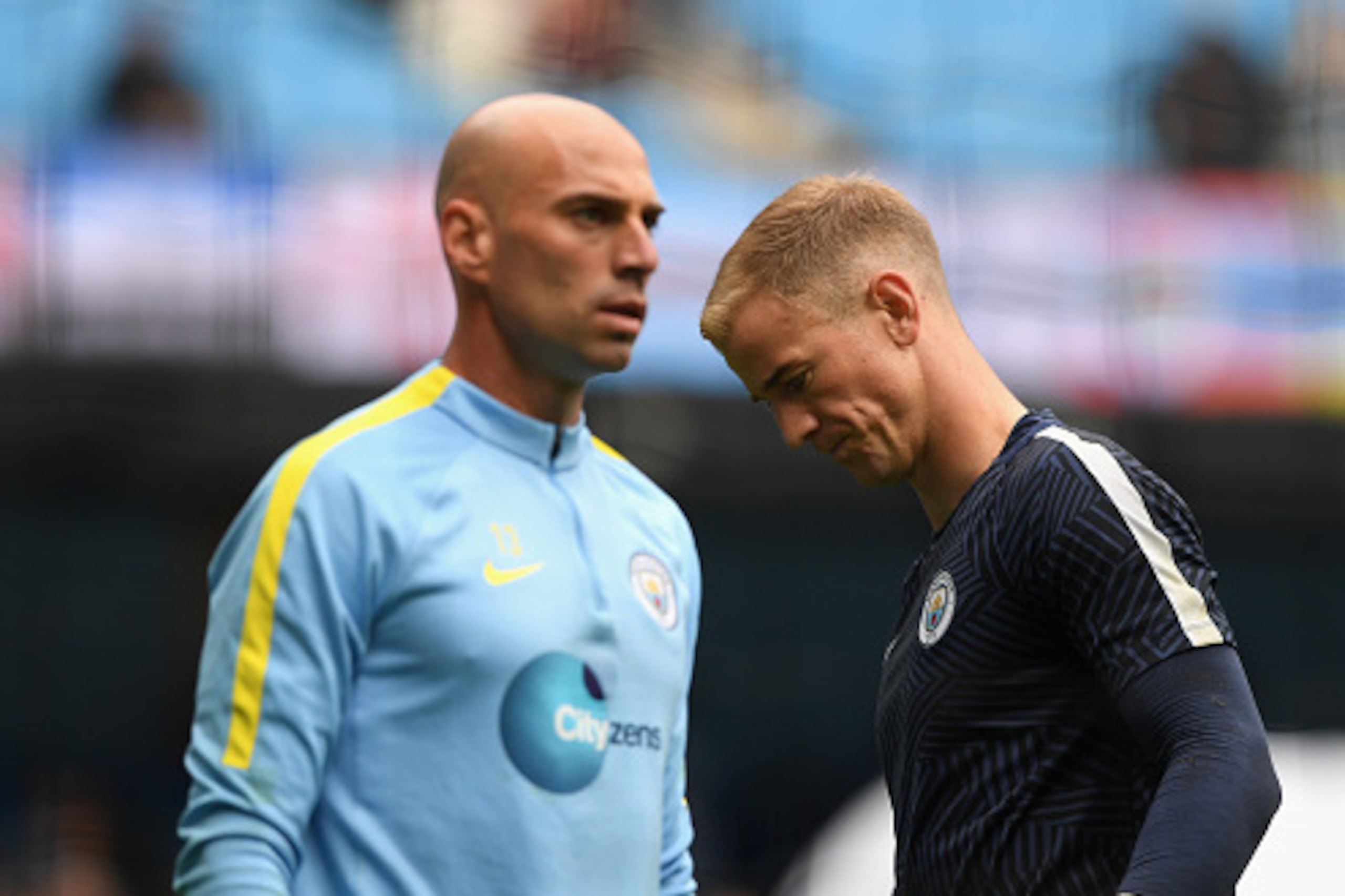 MANCHESTER, ENGLAND - AUGUST 13:  Manchester City goalkeepers Willy Caballero (l) and Joe Hart look on during the warm up before the Premier League match between Manchester City and Sunderland at Etihad Stadium on August 13, 2016 in Manchester, England.  
