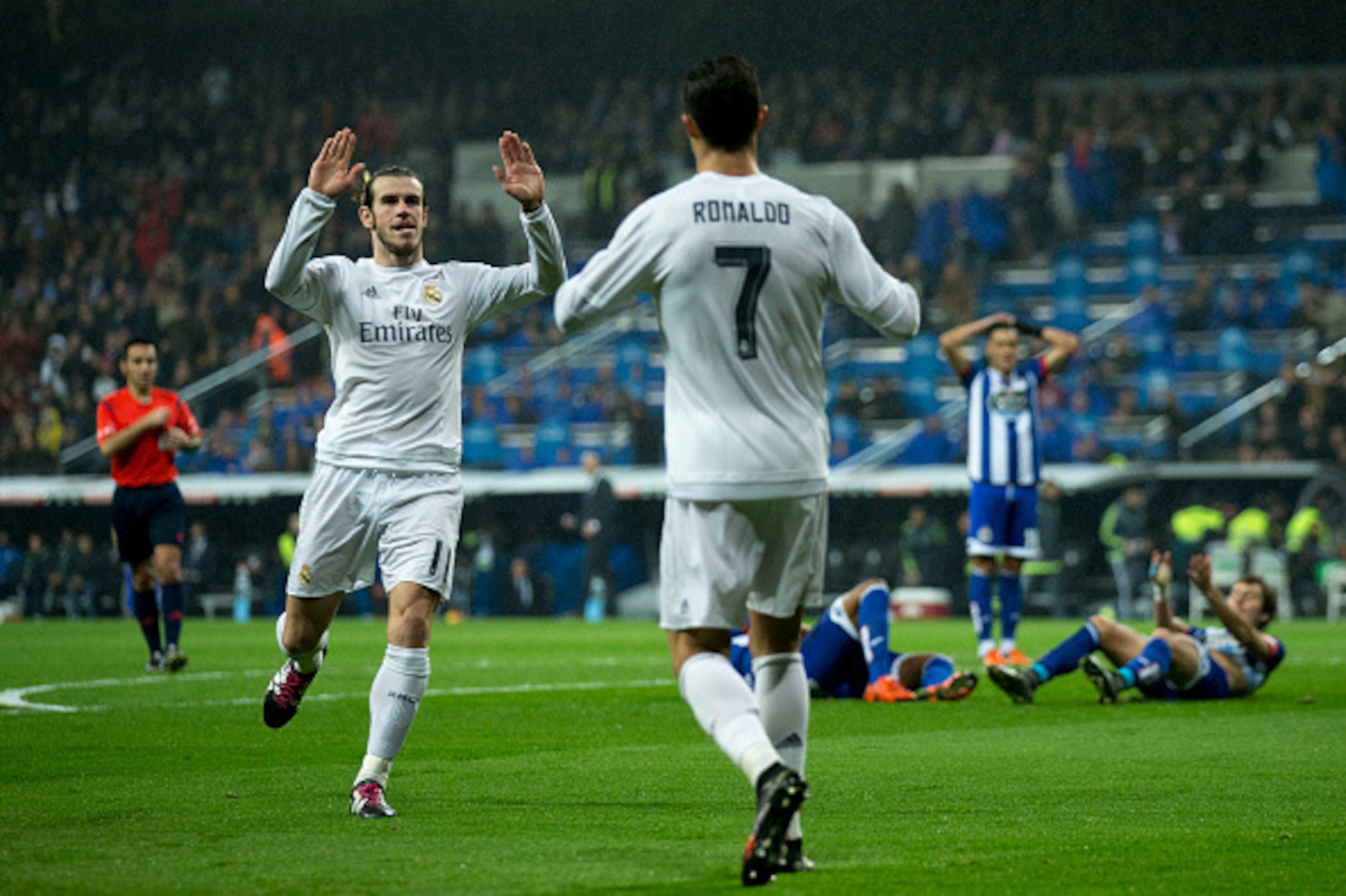 Real Madrid's Welsh forward Gareth Bale (L) celebrates a goal with Real Madrid's Portuguese forward Cristiano Ronaldo during the Spanish league football match Real Madrid CF vs RC Deportivo de la Coruna at the Santiago Bernabeu stadium in Madrid on Januar