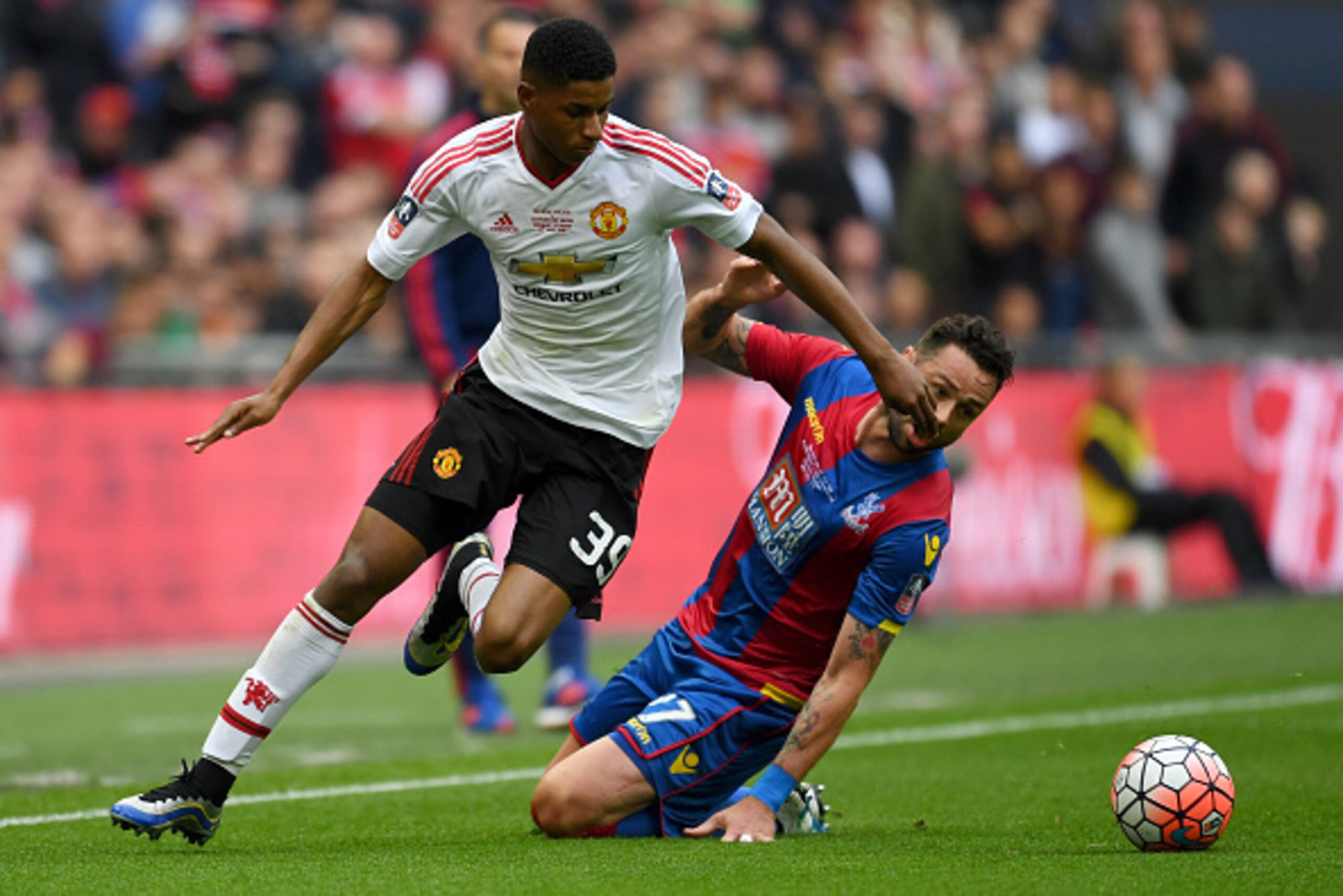 LONDON, ENGLAND - MAY 21:  Marcus Rashford of Manchester United evades Damien Delaney of Crystal Palace during The Emirates FA Cup Final match between Manchester United and Crystal Palace at Wembley Stadium on May 21, 2016 in London, England.  (Photo by M
