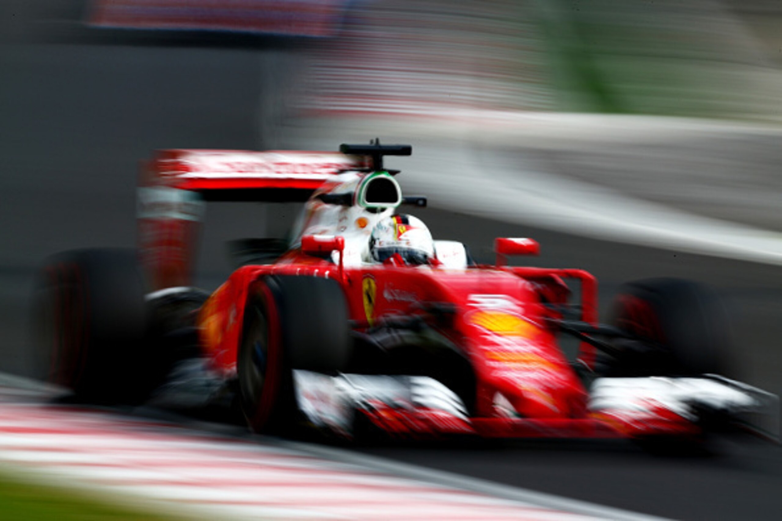 BUDAPEST, HUNGARY - JULY 22: Sebastian Vettel of Germany driving the (5) Scuderia Ferrari SF16-H Ferrari 059/5 turbo (Shell GP) on track during practice for the Formula One Grand Prix of Hungary at Hungaroring on July 22, 2016 in Budapest, Hungary.  (Phot