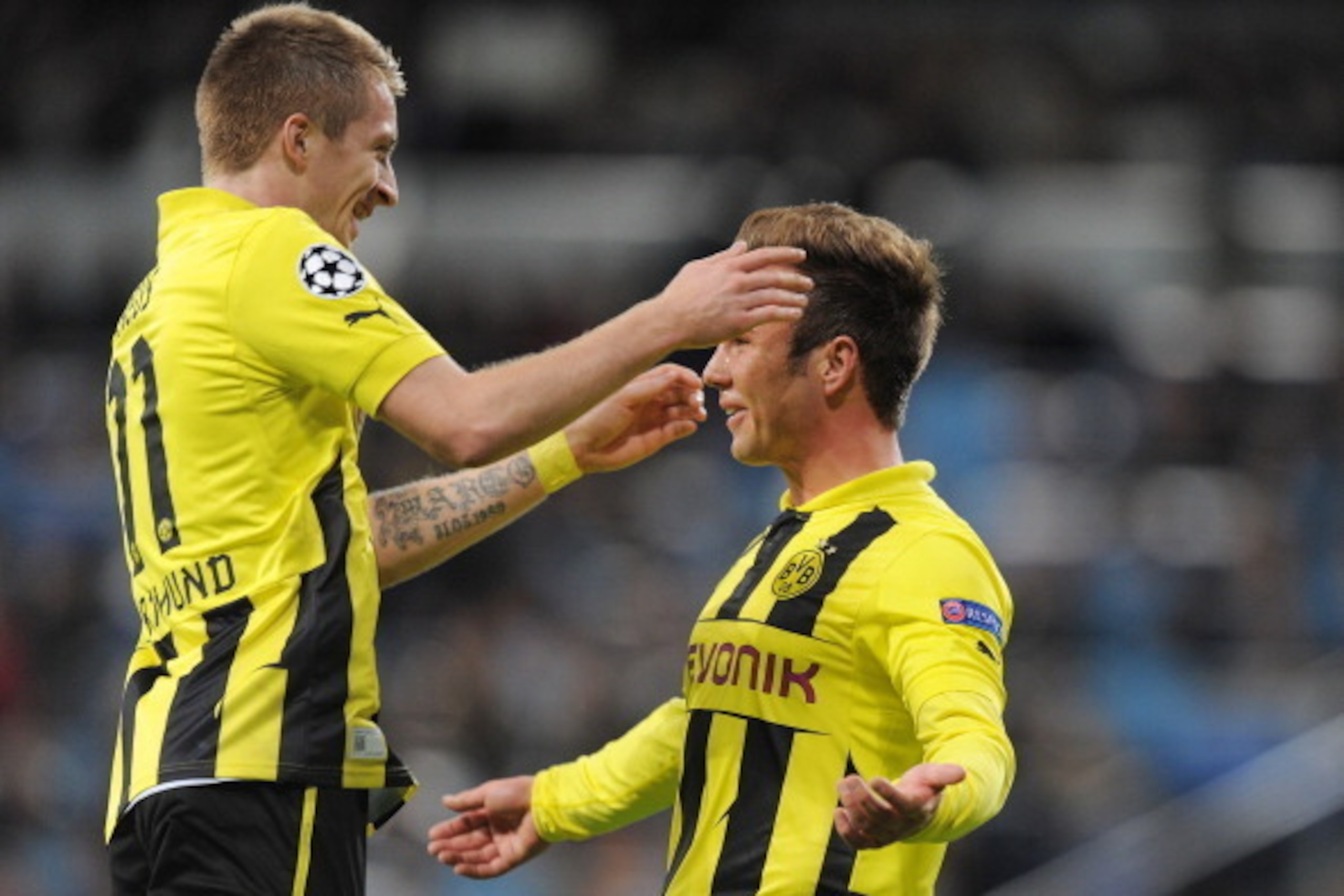 MADRID, SPAIN - NOVEMBER 06:  Mario Gotze (R) of of Borussia Dortmund celebrates with Marco Reus after scoring their team's second goal during the UEFA Champions League Group D match between Real Madrid and Borussia Dortmund at Estadio Santiago Bernabeu o
