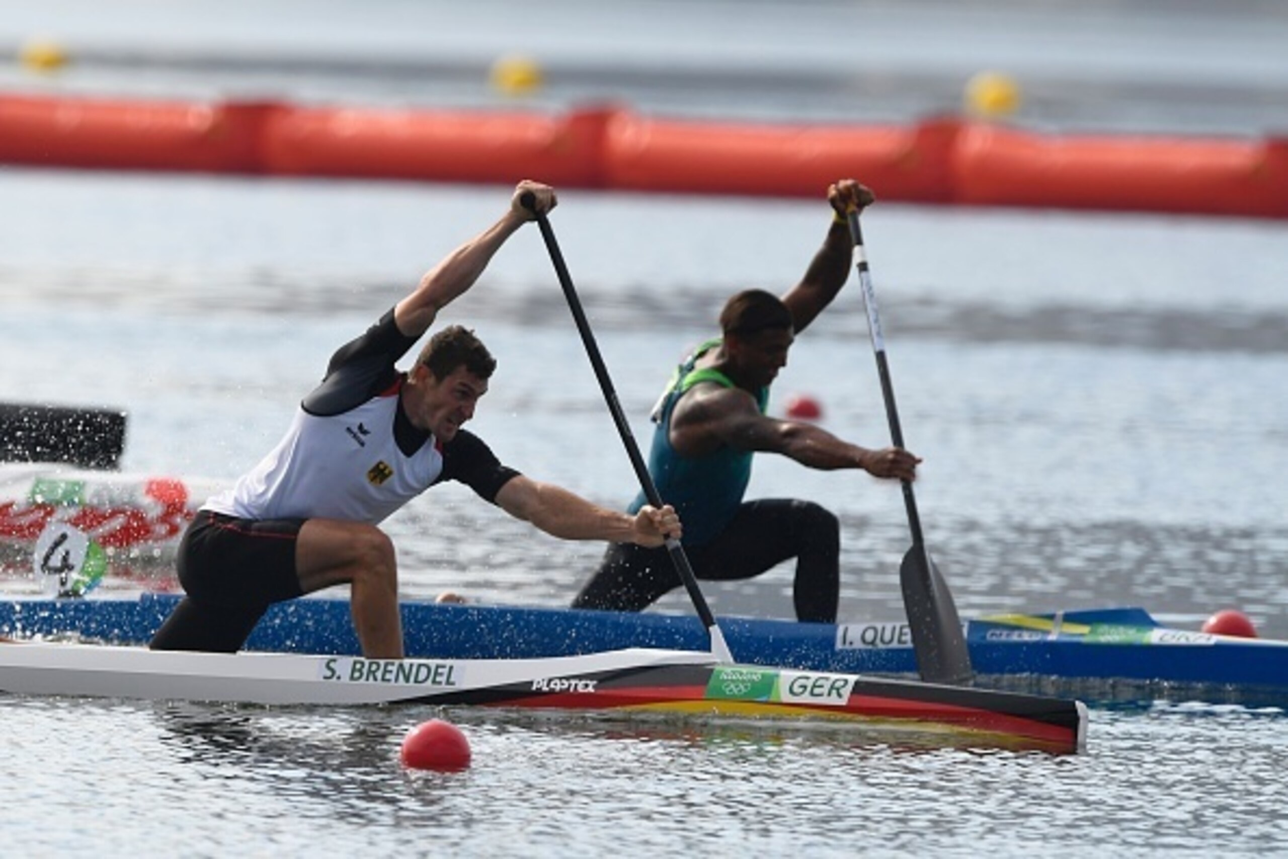 Germany's Sebastian Brendel competes (L) next to Brazil's Isaquias Queiroz Dos Santos the Men's Canoe Single (C1) 1000m final at the Lagoa Stadium during the Rio 2016 Olympic Games in Rio de Janeiro on August 16, 2016. / AFP / Damien MEYER        (Photo c