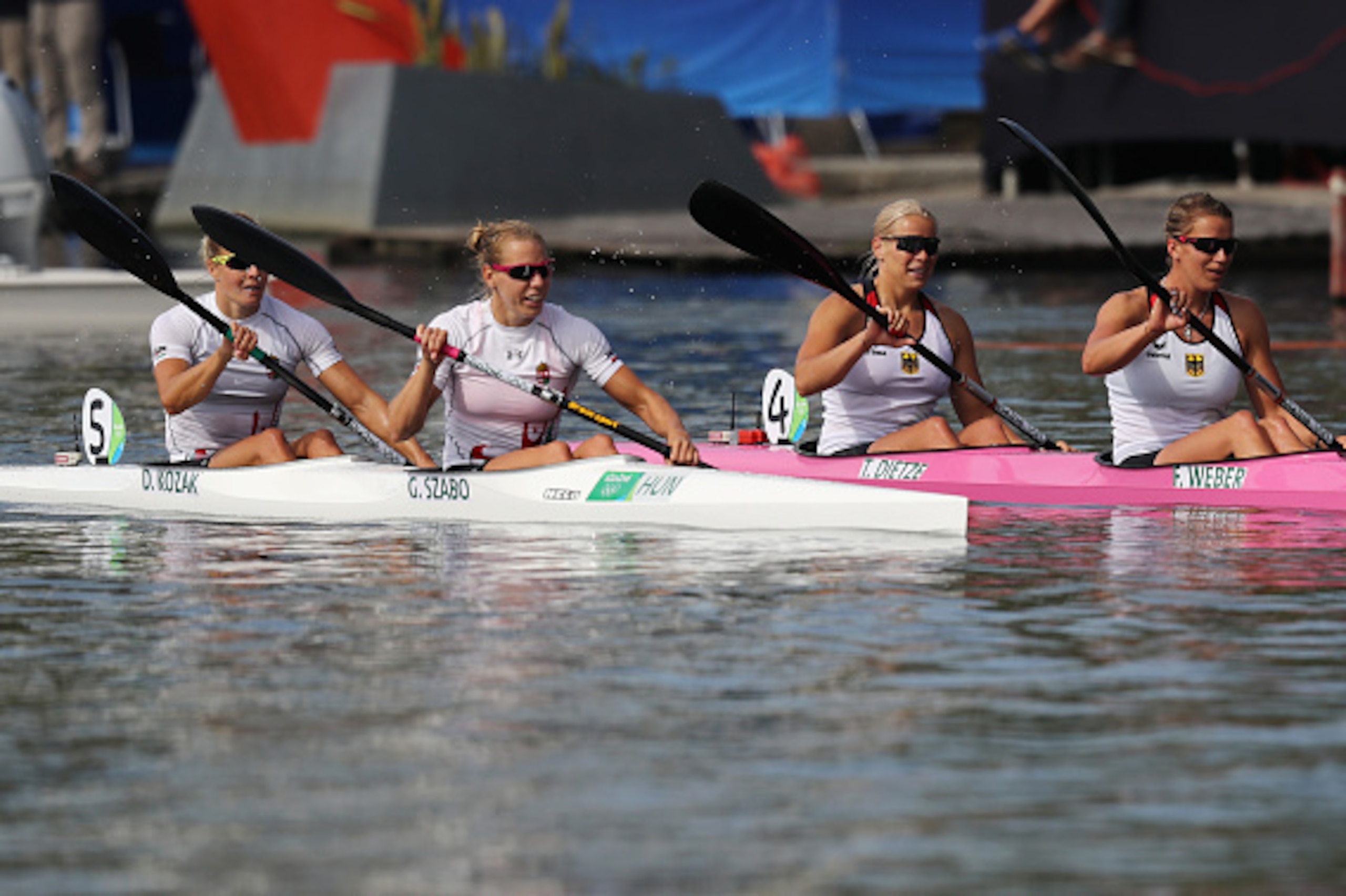 RIO DE JANEIRO, BRAZIL - AUGUST 16:  Franzi Weber and Tina Dietze of Germany look on with Gabriella Szabo and Danuta Kozak of Hungary after competing during the Women's Kayak Double 500m Final A on Day 11 of the Rio 2016 Olympic Games at the Lagoa Stadium