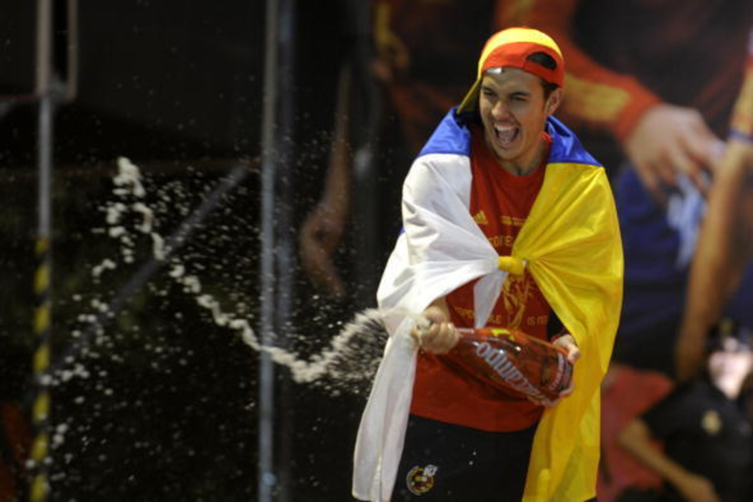 Spain's striker Pedro sprays champagne as he celebrates on a stage set up for the Spanish team victory ceremony in Madrid on July 12, 2010 a day after they won the 2010 FIFA football World Cup match against the Netherlands in Johannesburg. AFP PHOTO Spain's striker Pedro sprays champagne as he celebrates on a stage set up for the Spanish team victory ceremony in Madrid on July 12, 2010 a day after they won the 2010 FIFA football World Cup match against the Netherlands in Johannesburg. AFP PHOTO