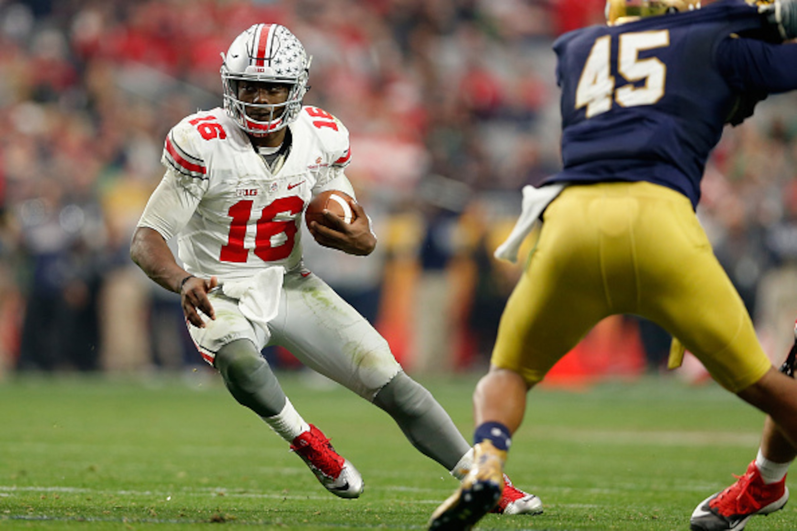 GLENDALE, AZ - JANUARY 01:  Quarterback J.T. Barrett #16 of the Ohio State Buckeyes scrambles with the football against the Notre Dame Fighting Irish during the BattleFrog Fiesta Bowl at University of Phoenix Stadium on January 1, 2016 in Glendale, Arizon