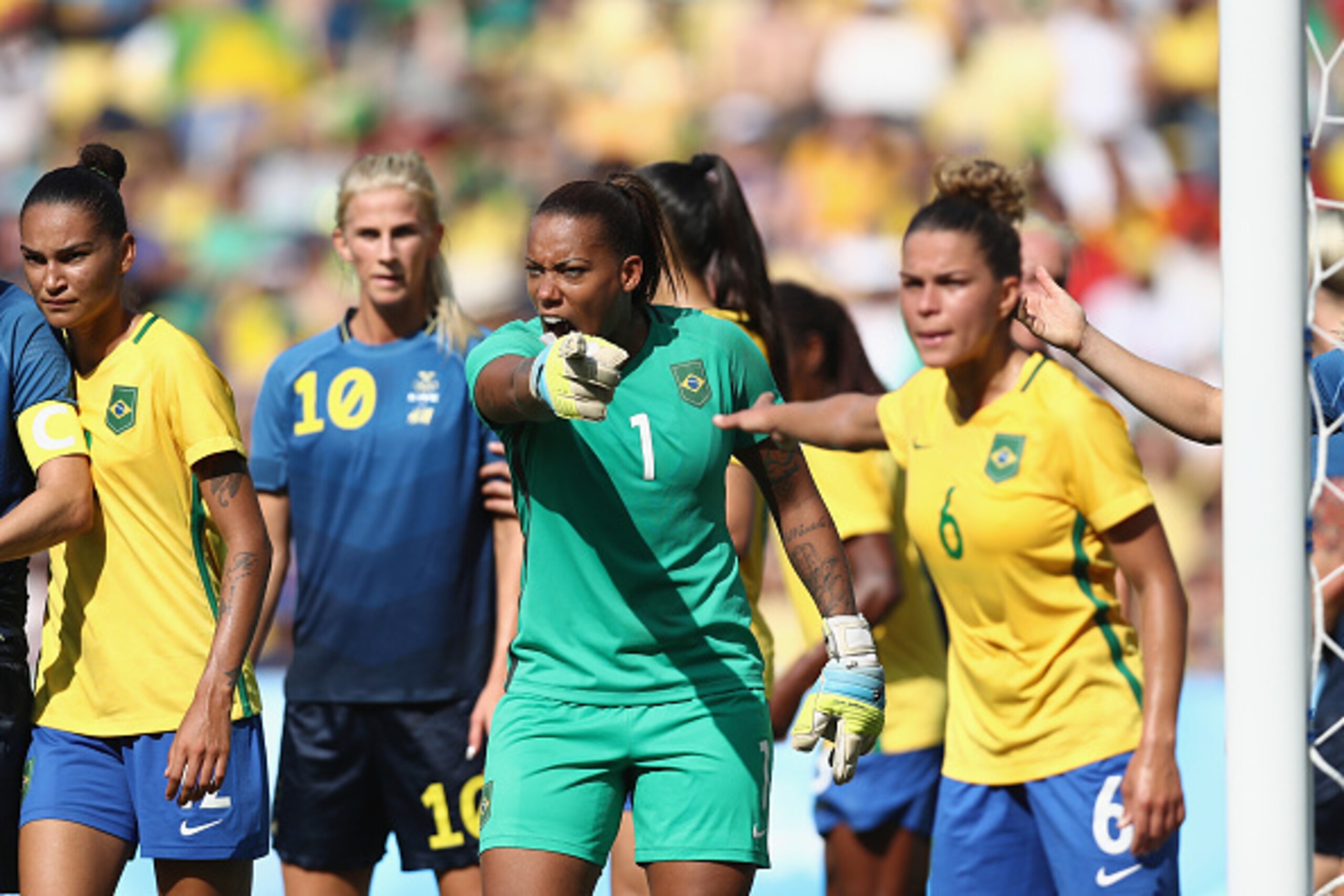 RIO DE JANEIRO, BRAZIL - AUGUST 16:  Barbara of Brazil (C) shouts instructions during the Women's Football Semi Final between Brazil and Sweden on Day 11 of the Rio 2016 Olympic Games at Maracana Stadium on August 16, 2016 in Rio de Janeiro, Brazil.  (Pho