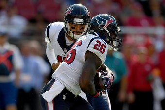 SANTA CLARA, CA - AUGUST 14:  Quarterback Brock Osweiler #17 of the Houston Texans hand the ball off to running back Lamar Miller #26 against the San Francisco 49ers in the first quarter at Levi's Stadium on August 14, 2016 in Santa Clara, California.  (P