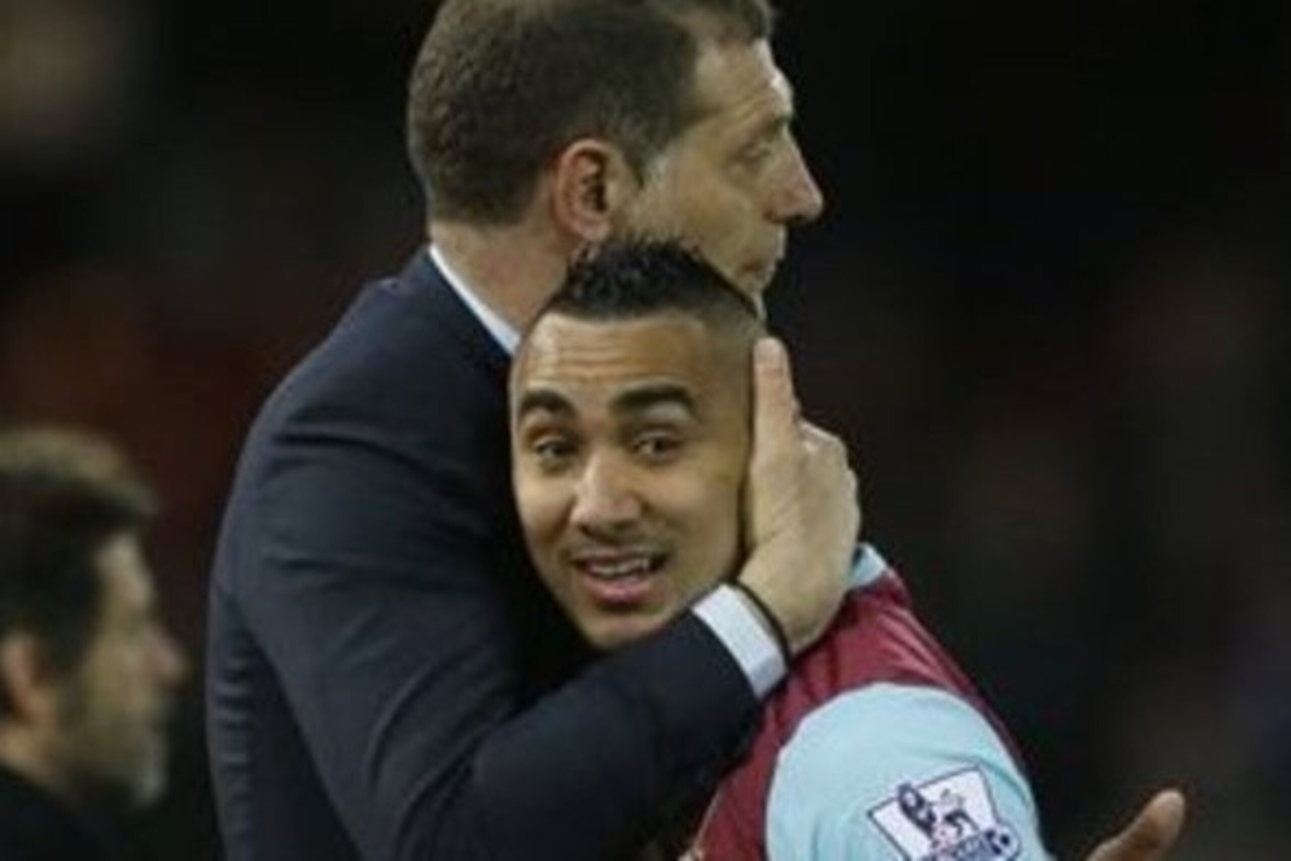 Slaven Bilic embraces his talisman Dimitri Payet.