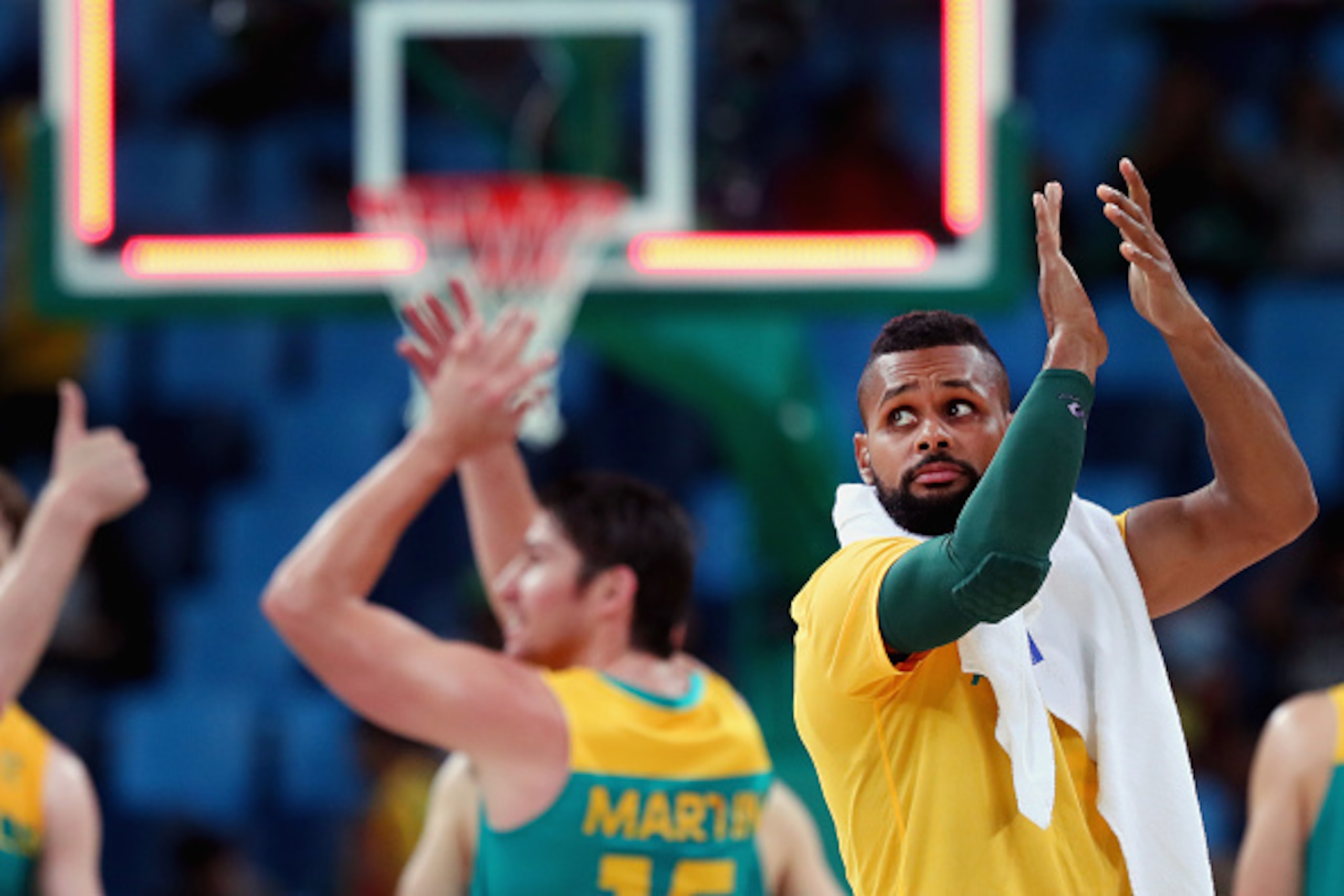 RIO DE JANEIRO, BRAZIL - AUGUST 12:  Patty Mills #5 of Australia celebrates after beating China during the Men's Basketball - Preliminary Round Group A China vs Australia on Day 7 of the Rio 2016 Olympic Games at Carioca Arena 1 on August 12, 2016 in Rio 
