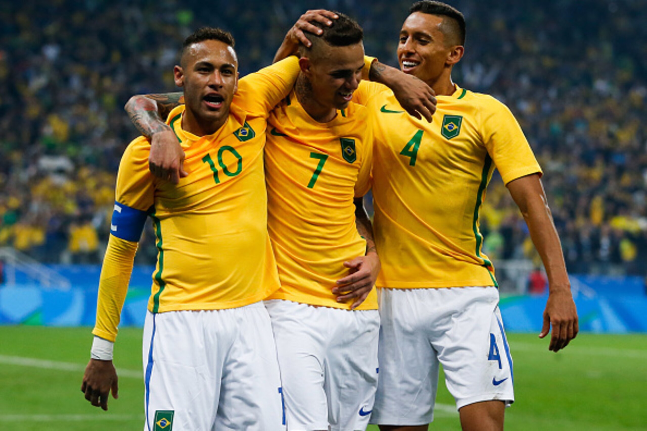 SAO PAULO, BRAZIL - AUGUST 13: (L-R) Neymar, Luan #07 and Marquinhos of Brazil celebrate their second goal during the match between Brazil and Colombia mens football quarter final at Arena Corinthians on August 13, 2016 in Sao Paulo, Brazil. (Photo by Ale