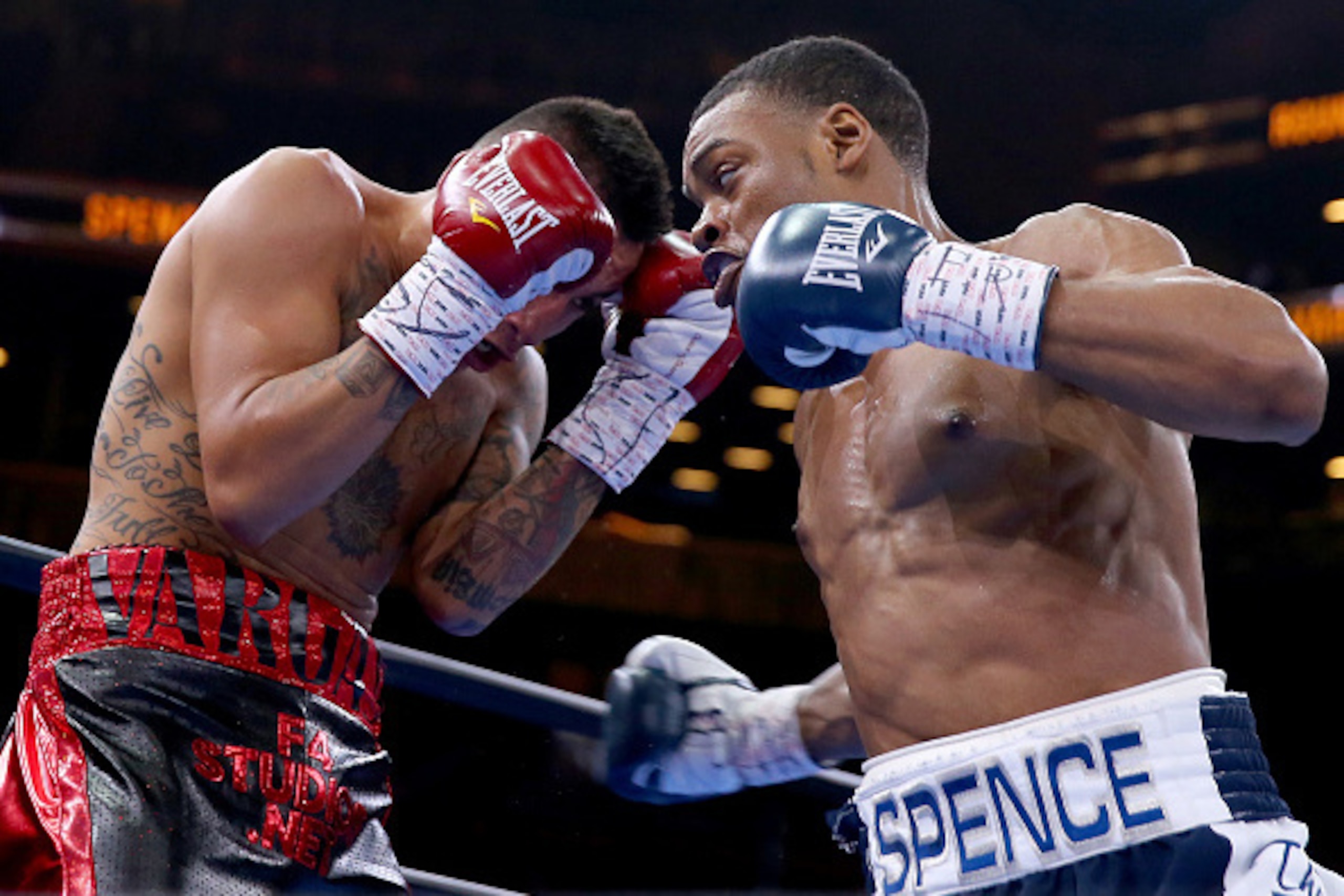 NEW YORK, NY - APRIL 11:  Errol Spence Jr and Samuel Vargas exchange punches during their Premier Boxing Champions bout at Barclays Center on April 11, 2015 in New York City.  (Photo by Elsa/Getty Images)