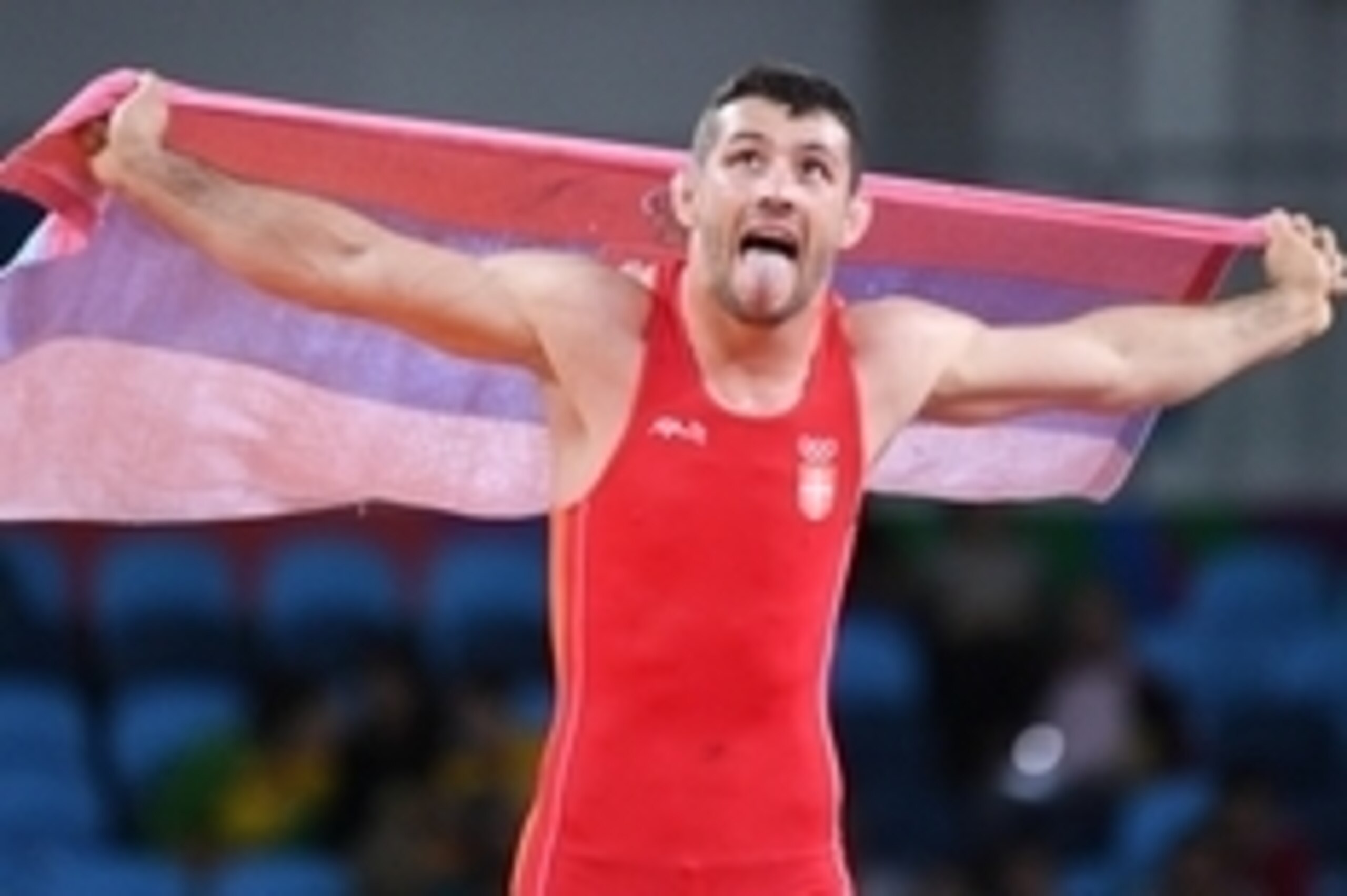 Aug 16, 2016; Rio de Janeiro, Brazil; Davor Stefanek (SRB) celebrates after defeating Migran Arutyunyan (ARM) in the the men's wrestling Greco-Roman 66kg gold medal match in the Rio 2016 Summer Olympic Games at Carioca Arena 2. Mandatory Credit: Robert Ha