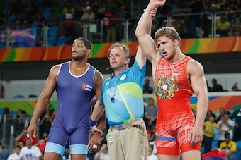 Armenia's Artur Aleksanyan celebrates after winning against Cuba's Yasmany Daniel Lugo Cabrera in their men's 98kg greco-roman final match on August 16, 2016, during the wrestling event of the Rio 2016 Olympic Games at the Carioca Arena 2 in Rio de Janeir