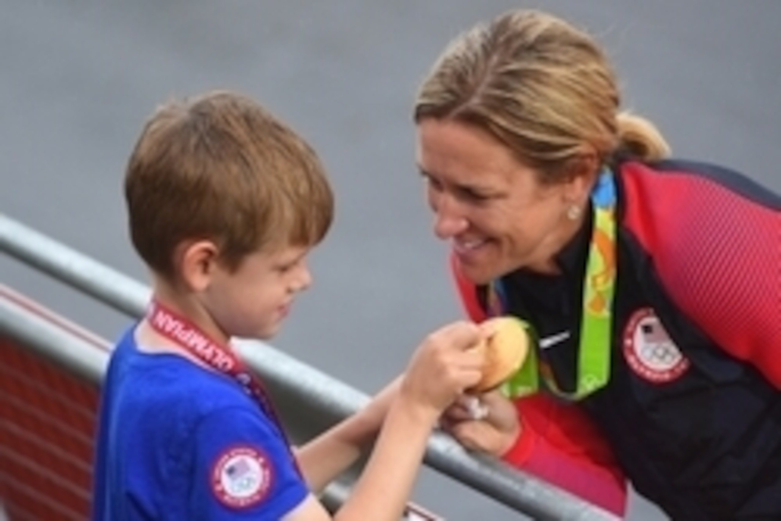 Aug 10, 2016; Rio de Janeiro, Brazil; Kristin Armstrong (USA) shows her gold medal to her son Lucas Savola, 5, after the women's individual time trial medal ceremony at Pontal during the Rio 2016 Summer Olympic Games. Mandatory Credit: Jack Gruber-USA TOD Aug 10, 2016; Rio de Janeiro, Brazil; Kristin Armstrong (USA) shows her gold medal to her son Lucas Savola, 5, after the women's individual time trial medal ceremony at Pontal during the Rio 2016 Summer Olympic Games. Mandatory Credit: Jack Gruber-USA TOD