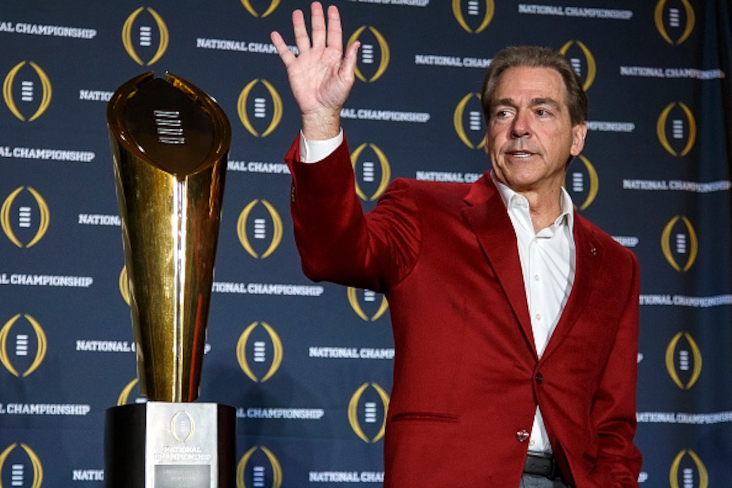 SCOTTSDALE, AZ - JANUARY 12: Head Coach Nick Saban of the Alabama Crimson Tide pose with the College Football Playoff National Championship Trophy during the MVP Press Conference after winning the College Football Playoff National Championship at the JW M
